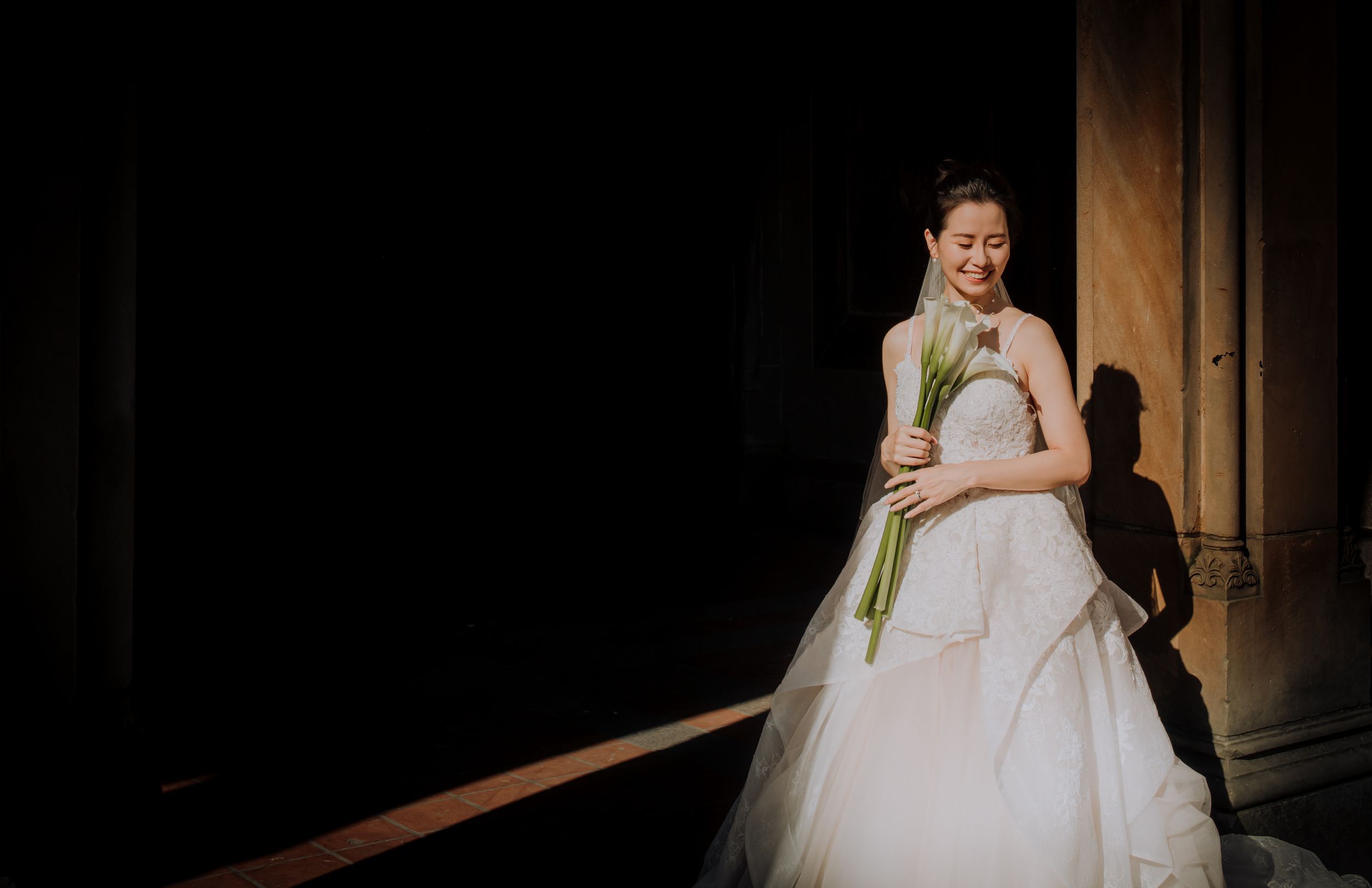 Bride in an elegant white wedding dress poses in atmospheric lighting at various angles in connected photo collage.