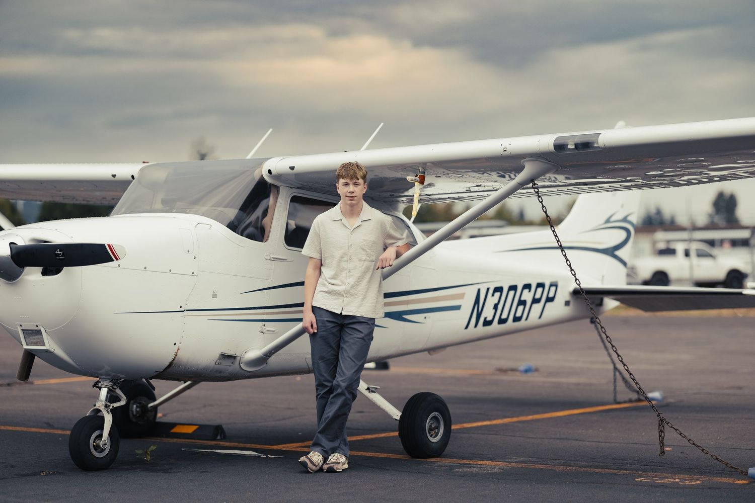 A collection of four vintage aircraft photos showing small planes parked on an airfield with pilots standing nearby.