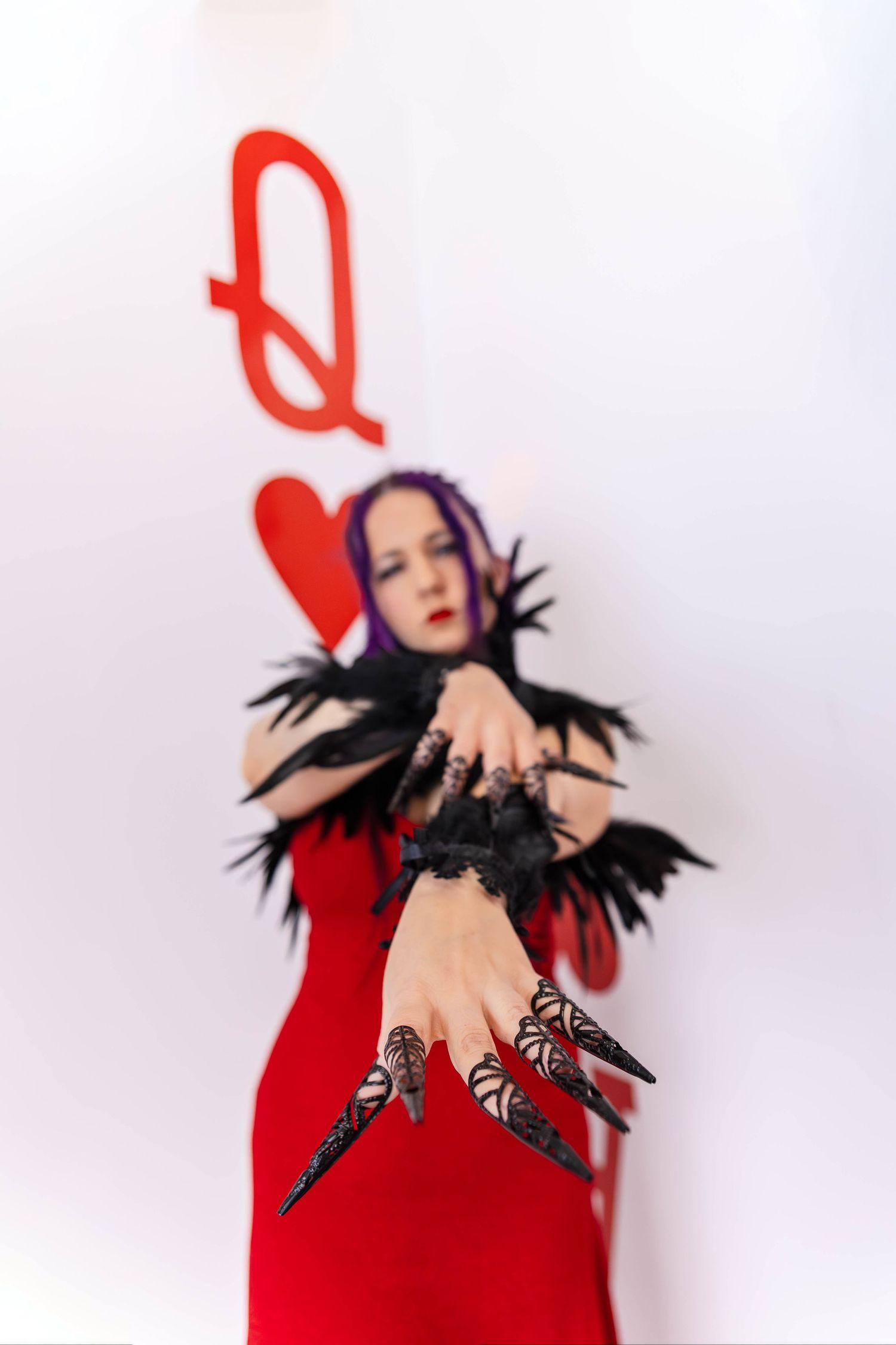 An edgy Queen of Hearts poses for the camera.