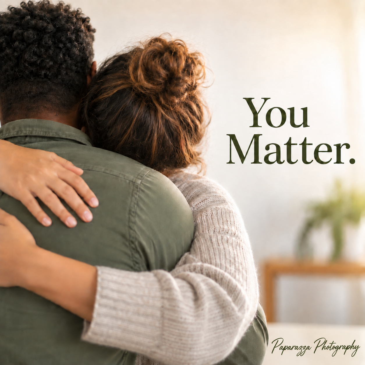 Two people sharing a warm embrace with the uplifting message You Matter overlaid on the image.