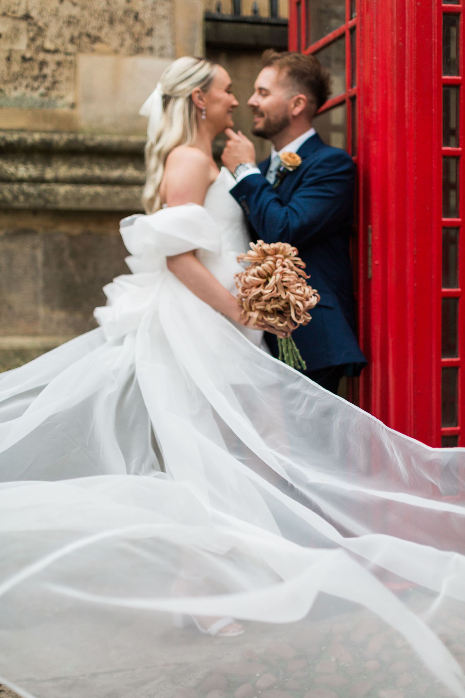 Hayley Elizabeth wedding photographer - elopement micro wedding in Oxford at Bodelian library Oxfordshire. bride and groom by telephone box