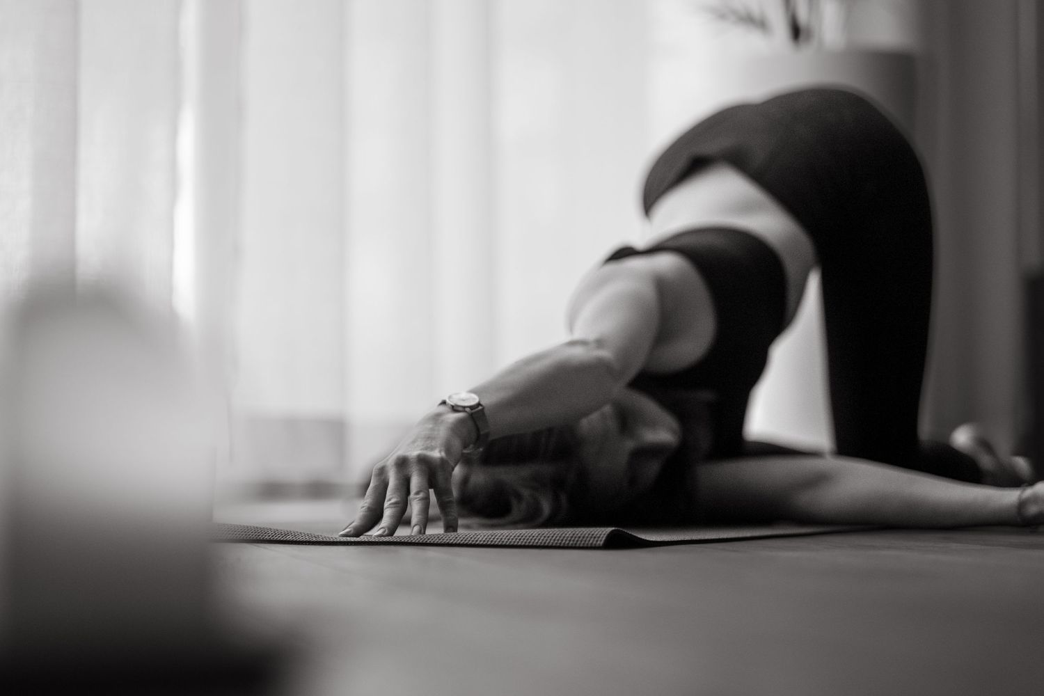 a yoga teacher bending in a pose while being captured by yoga photographer in Stockholm
