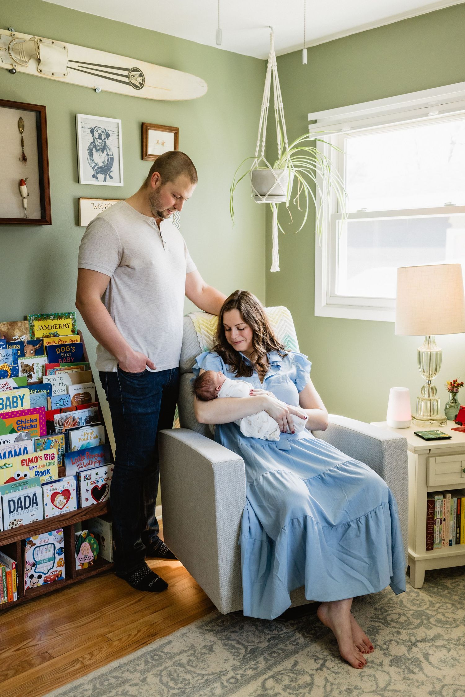 Jacob and Jessica hold their newborn baby.