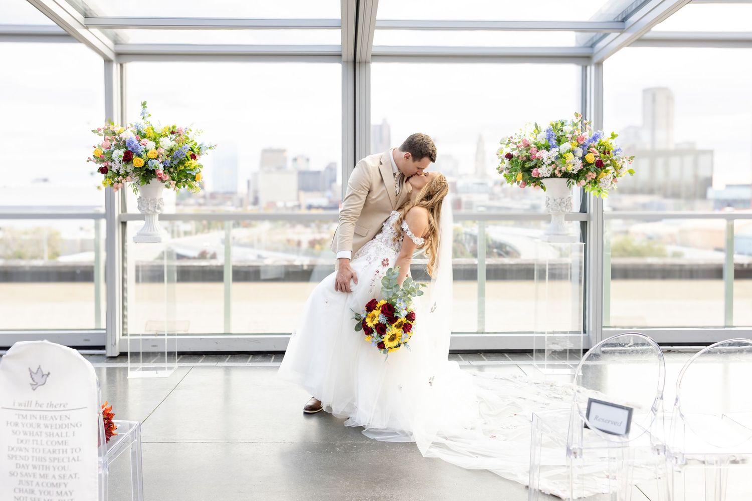 Couple portraits on Revery rooftop with downtown Columbus skyline, photographed by Julia & Sean Photography