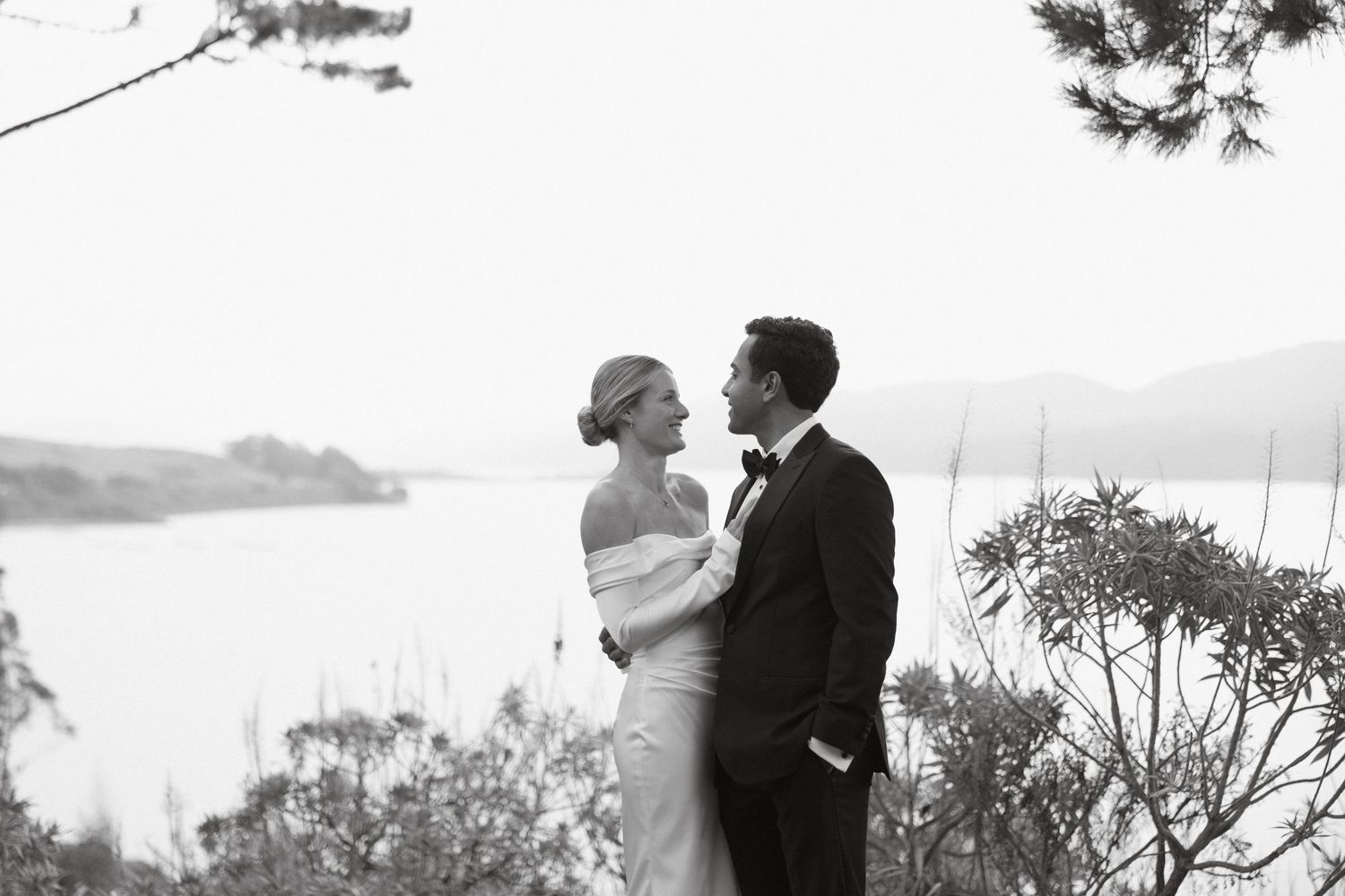 Black and white couple portrait overlooking Tomales Bay in Northern California with a timeless, romantic feel