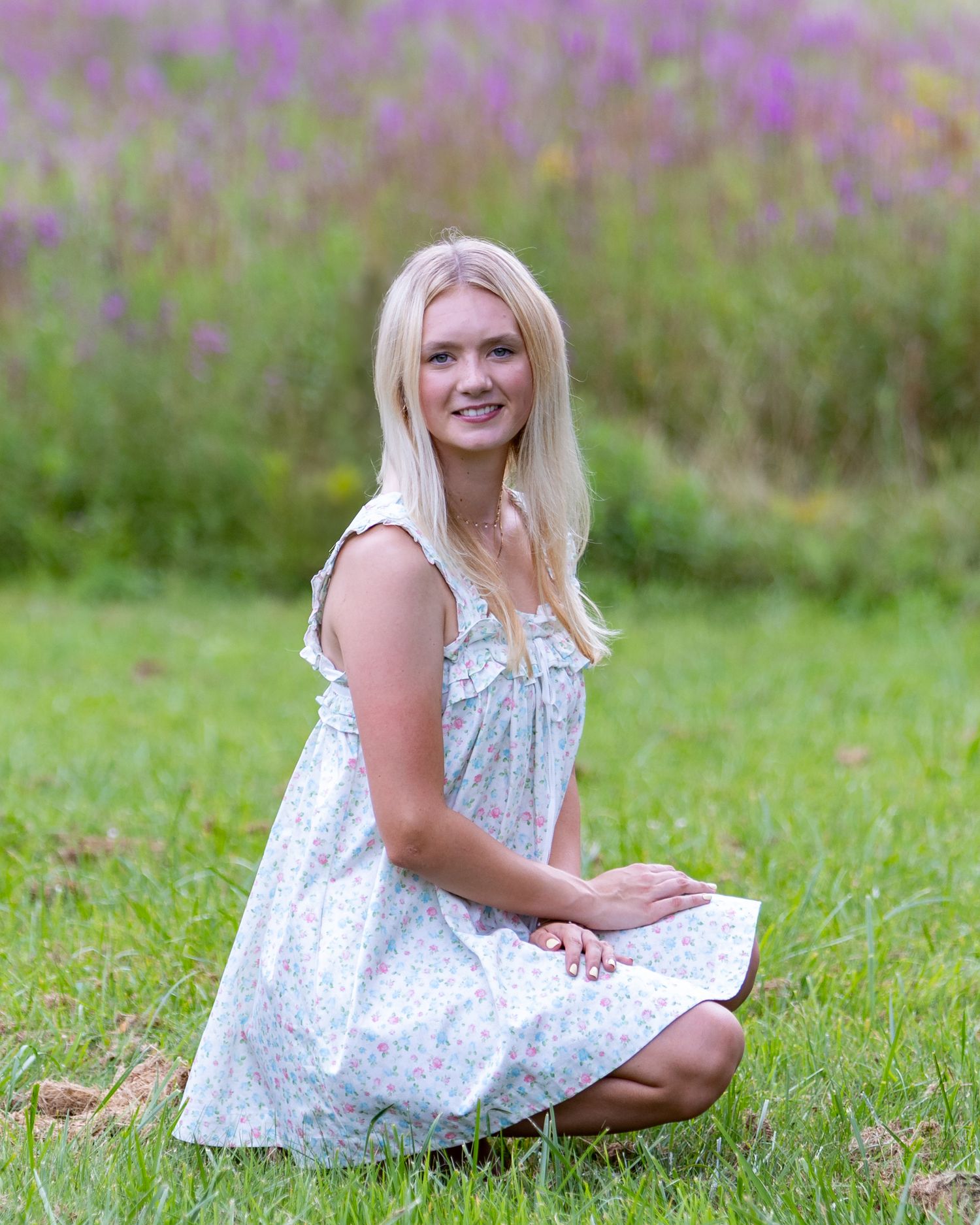 High school senior from Lincoln Sudbury poses for yearbook photos in a wildflower field.  Serving Weston High School and Concord Carlisle .