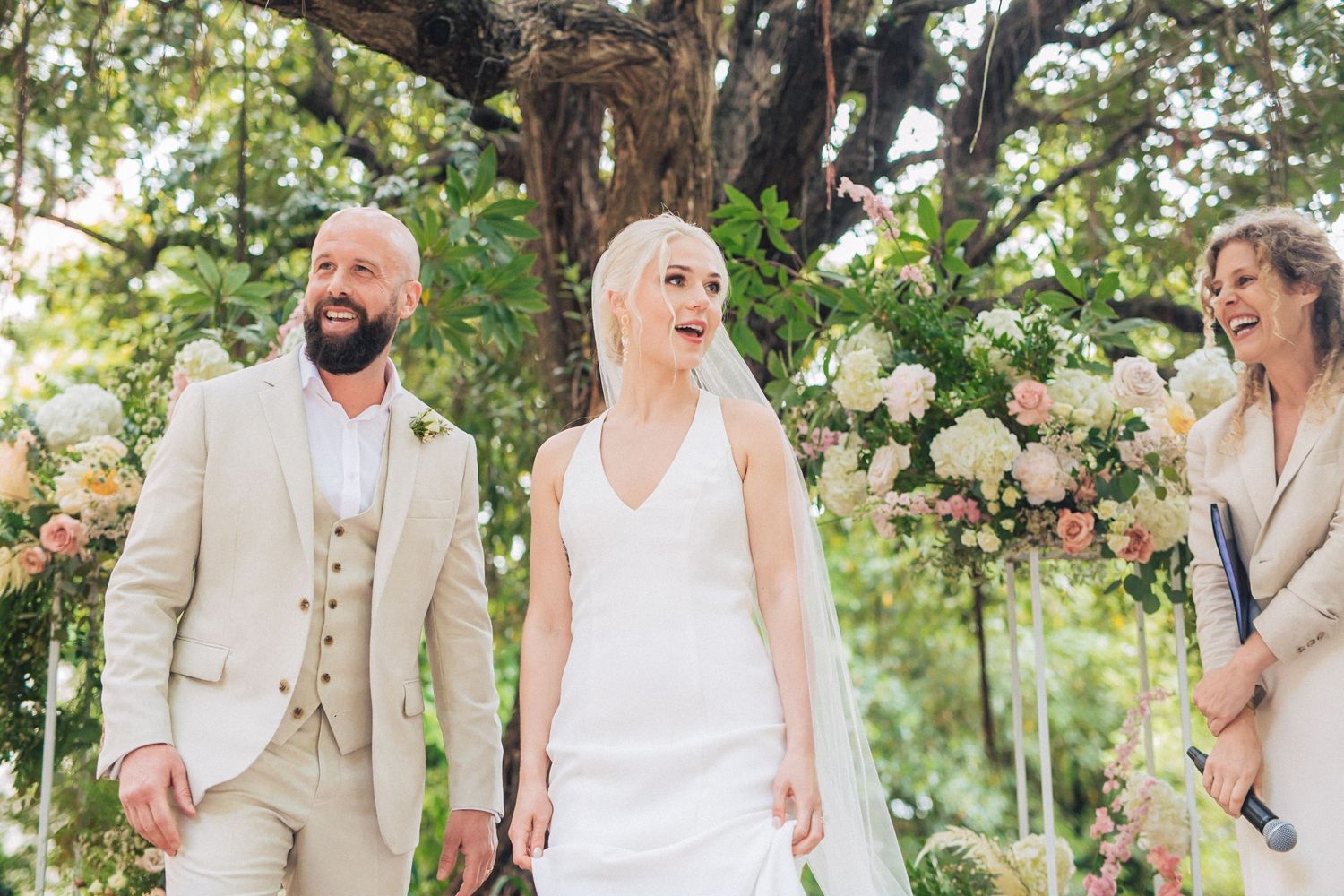 Wedding ceremony guests and newlyweds celebrate at casa dos penedos in Sintra. captured by a destination wedding photographer in Portugal