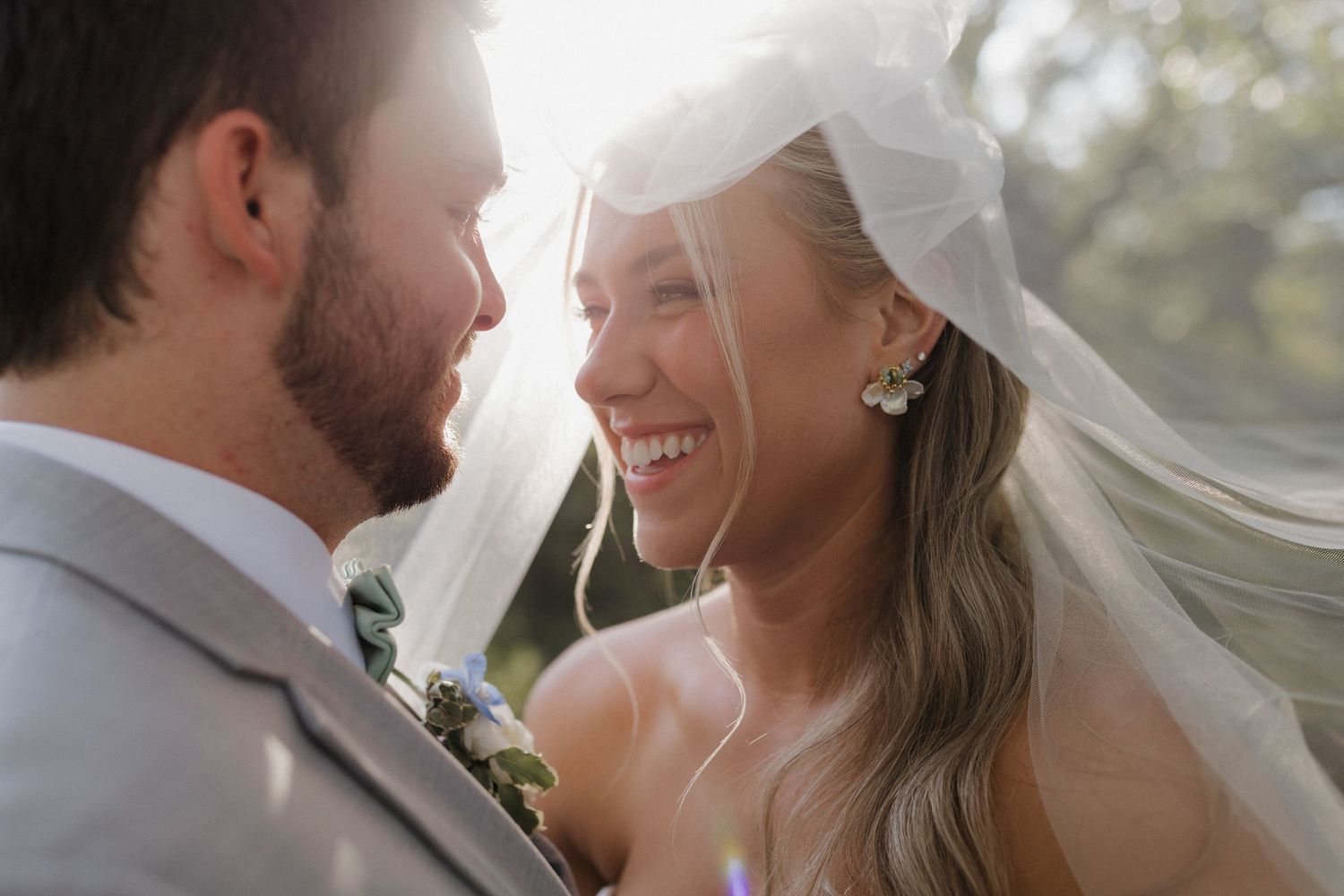 Black and white photo series showing a happy couple in wedding attire outdoors with candid interaction.