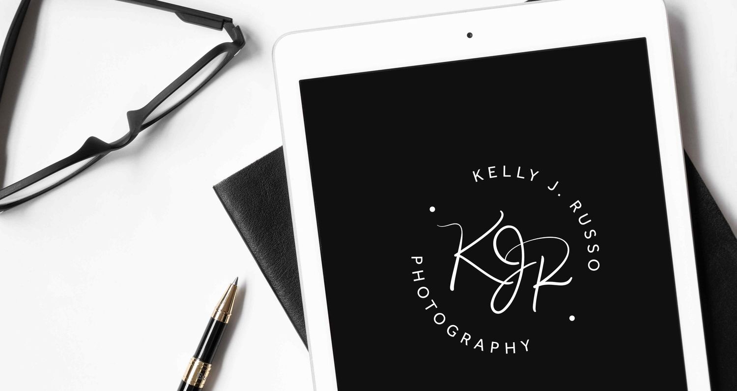 white ipad screen with Kelly J. Russo Photography logo on it