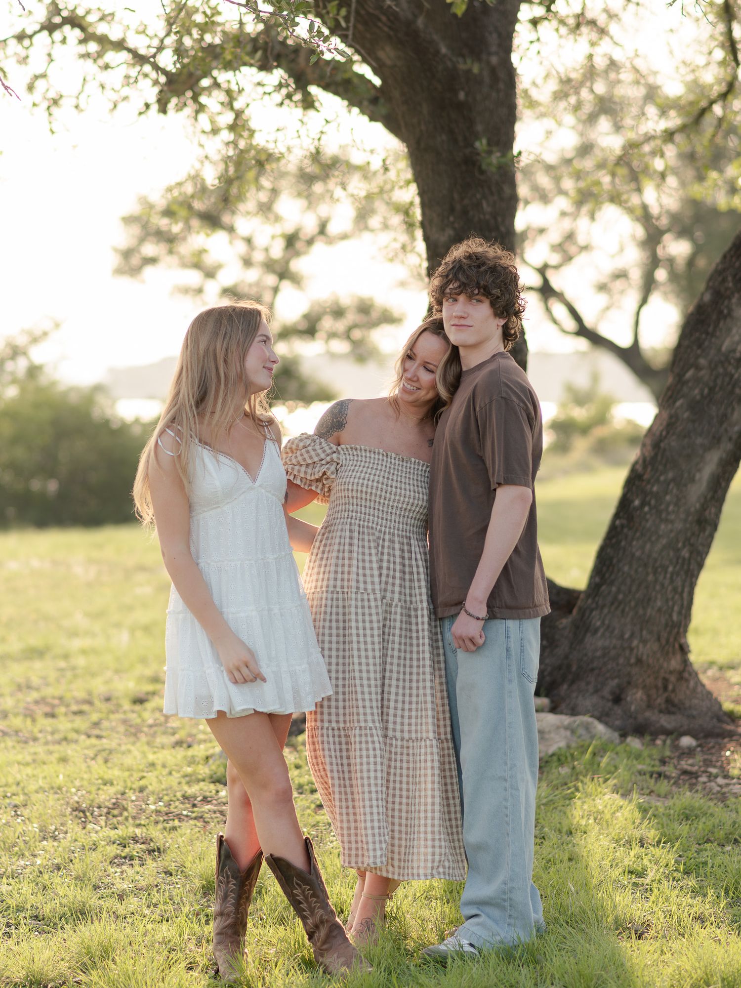 Family smiling together during session with a Belton, Texas Family Photographer