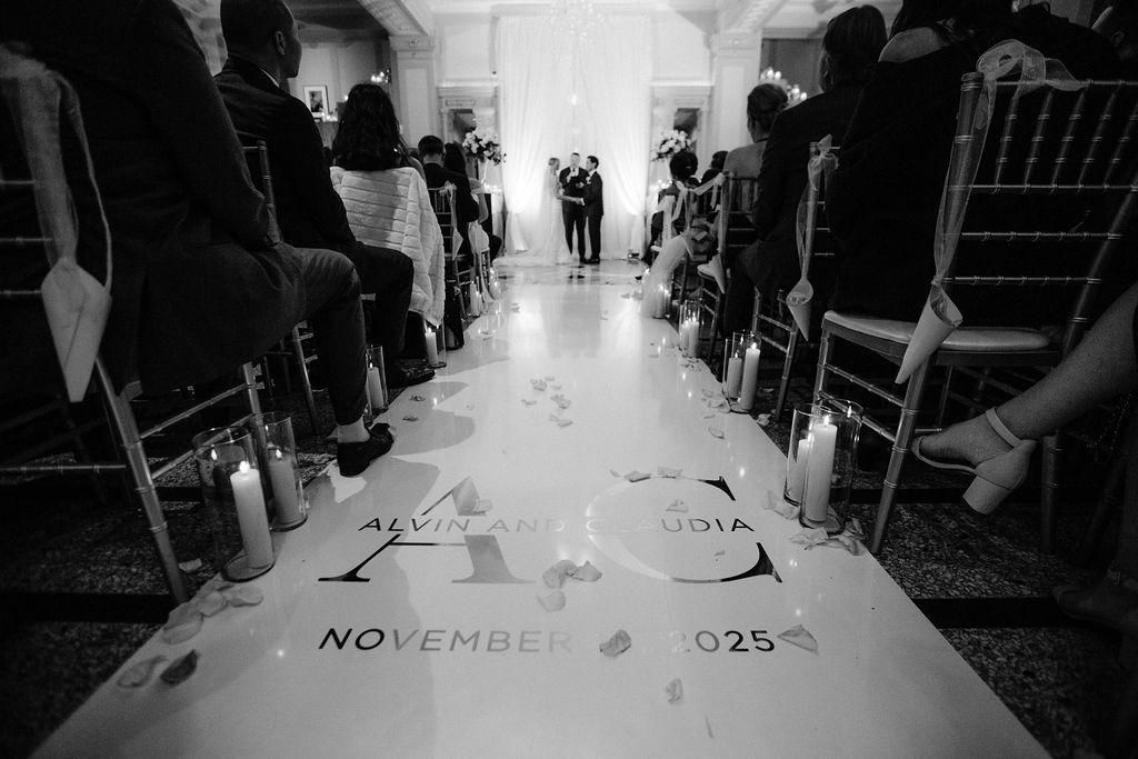 Elegant ballroom wedding reception with crystal chandeliers, white floral centerpieces and gold accents throughout the space. Fairmont Hotel