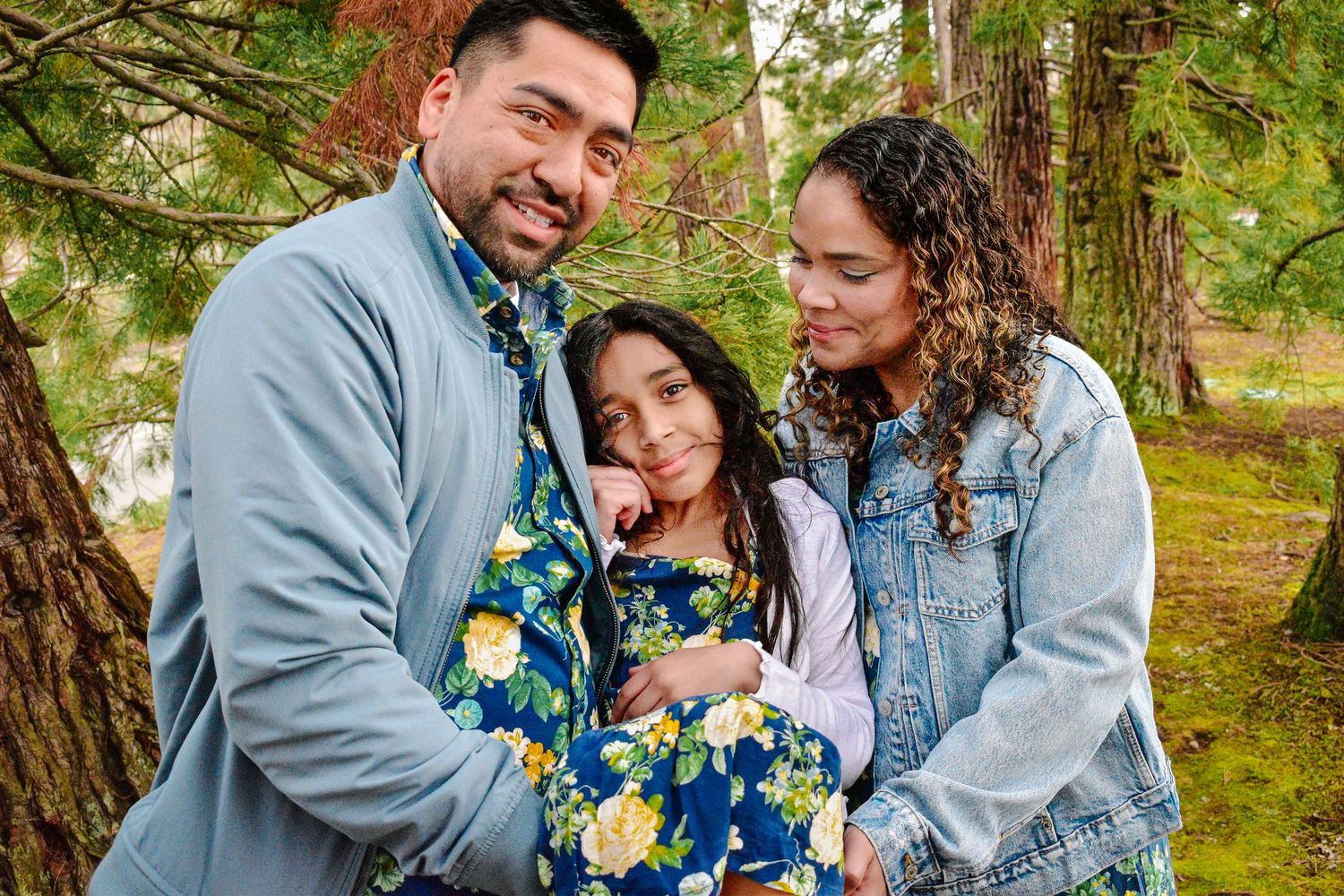Family hugging during fall family photography session in Seattle forest