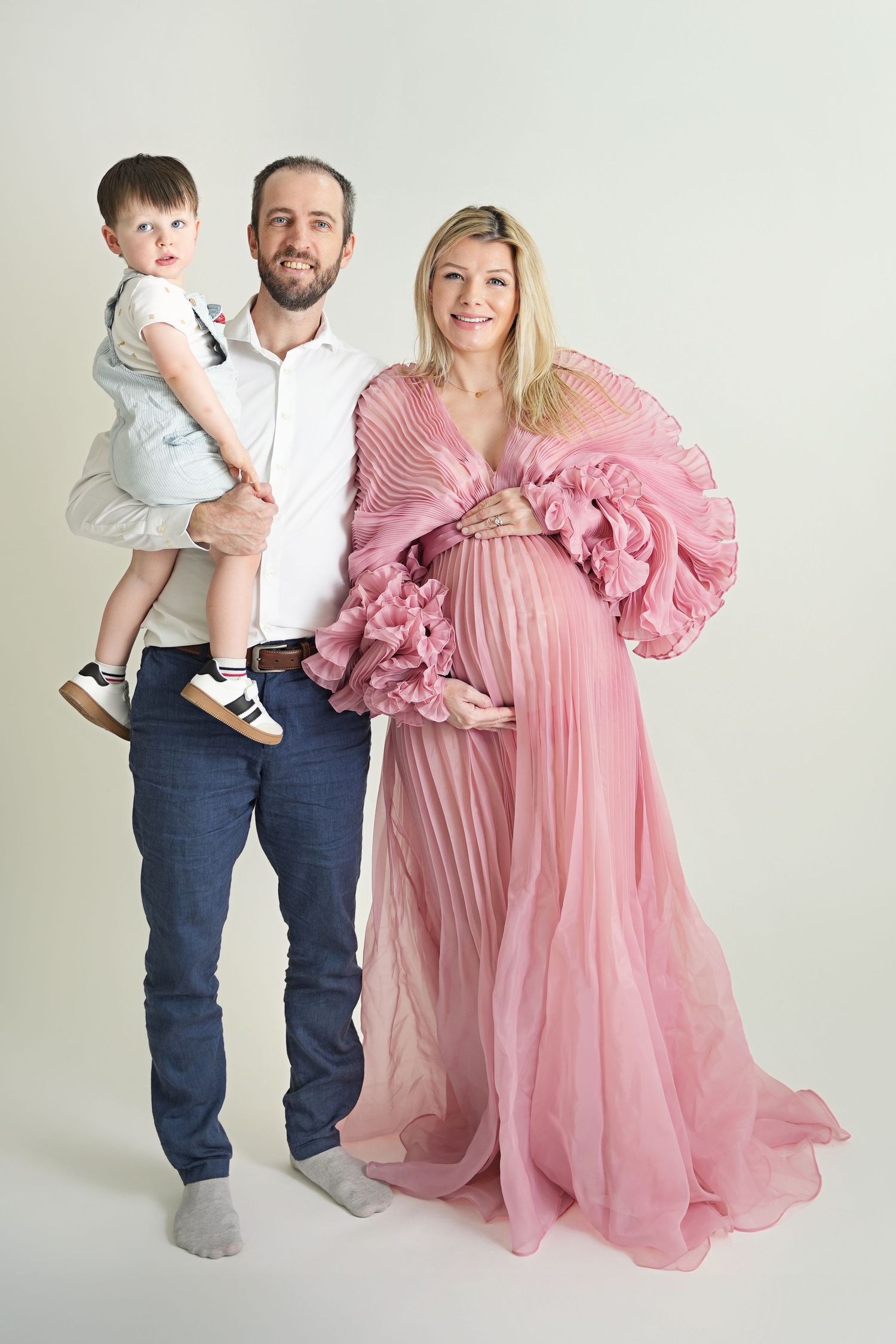 Family photoshoot in Dubai capturing candid moments of parents and children together, showcasing joy, connection, and timeless memories