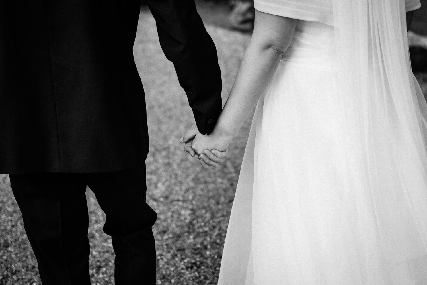 bride and groom holding hands at Wedding Knowle Country House in Kent