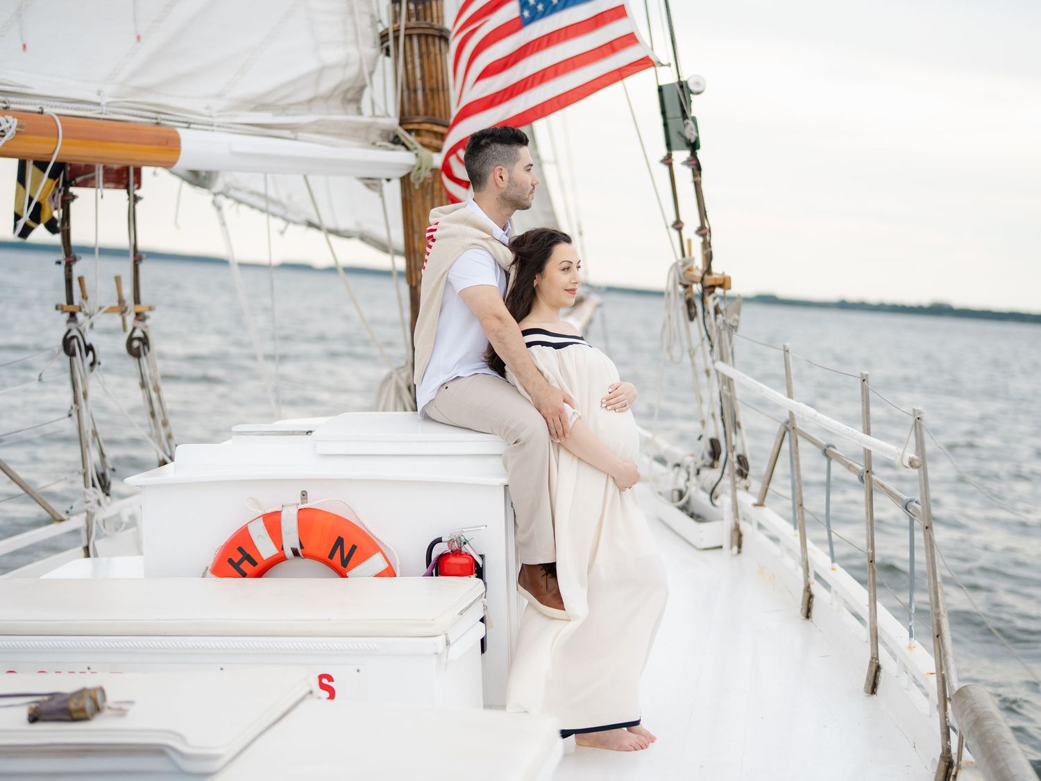 Monmouth county photographer lauren marie photography llc shots a expecting couple on a sailboat maternity session.