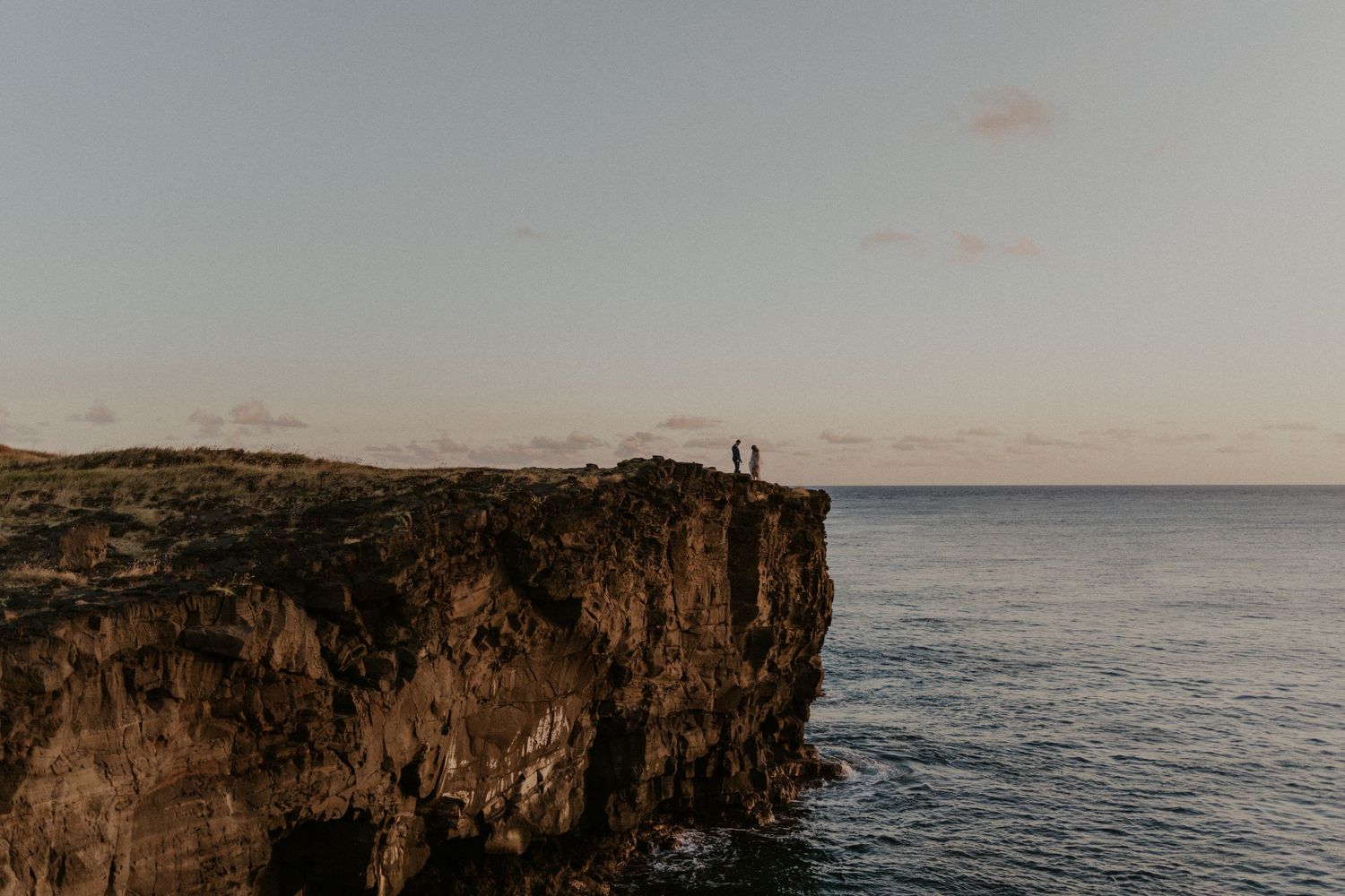 Wedding couple eloping on a cliff on the Big Island of Hawaii