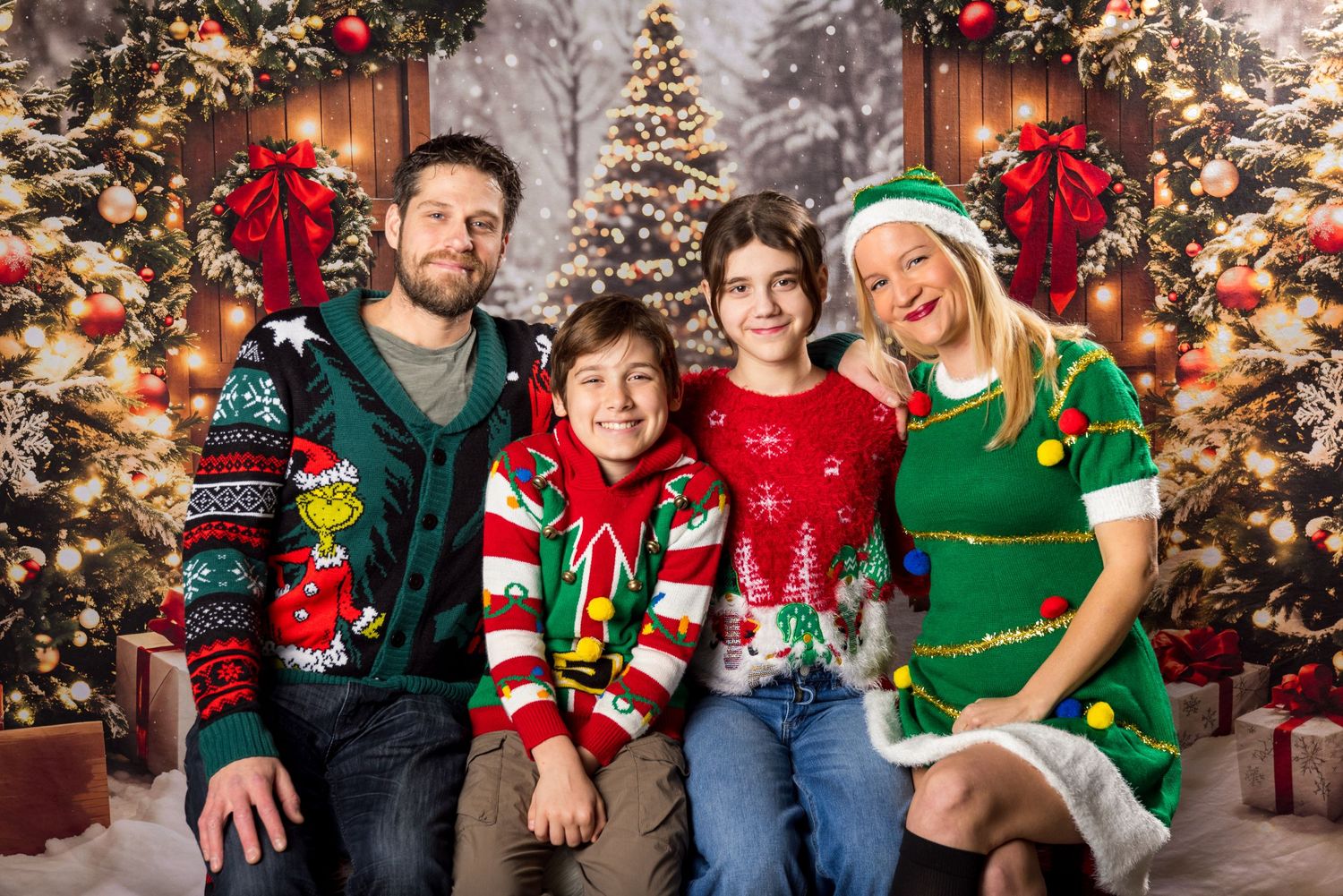 A family getting their christmas portrait taken in a photobooth at Russell Flea Market Ontario, Canada
