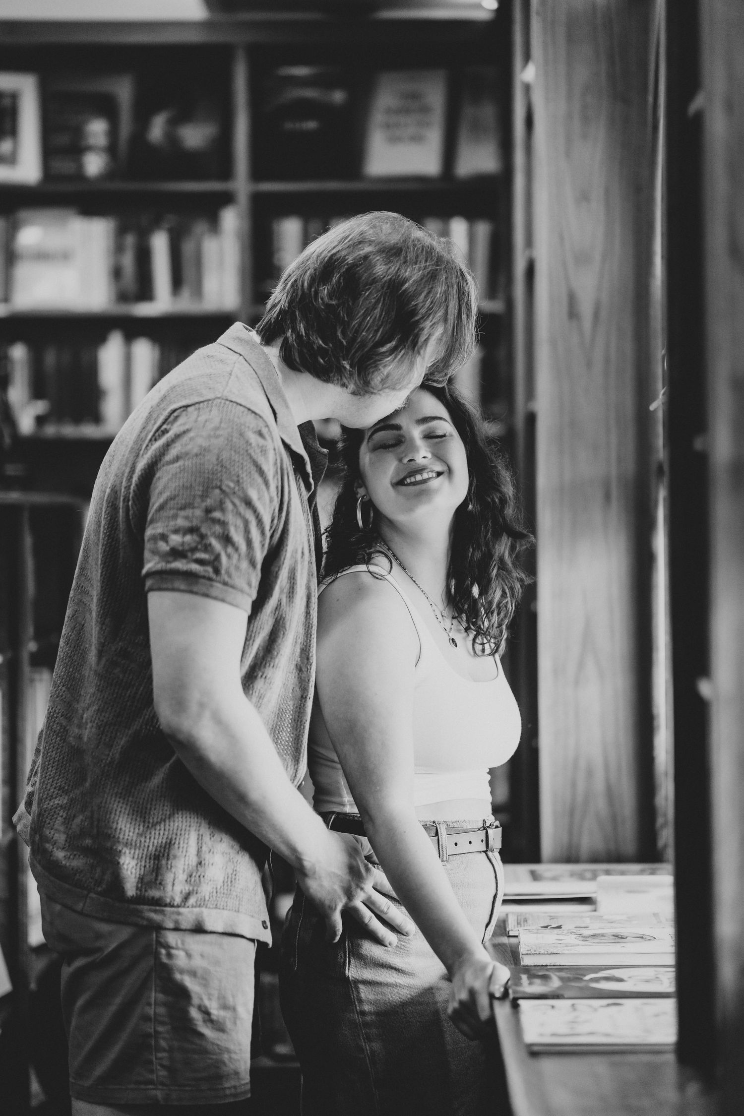 Eric gives Marie a kiss on the forehead.