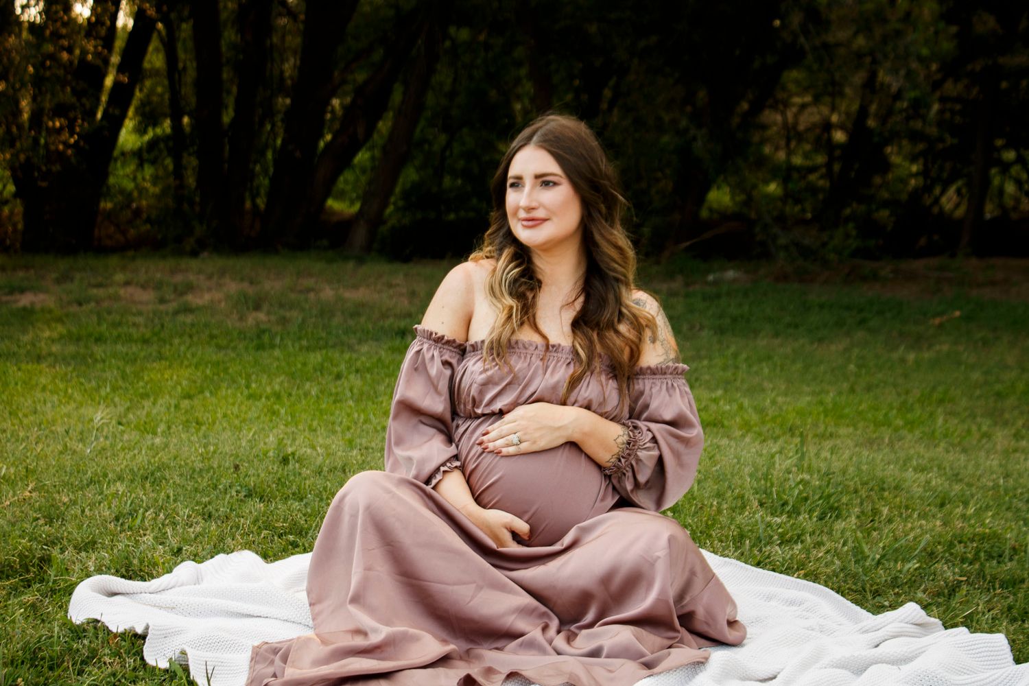 An expecting mother during a maternity photo session at The League House in Amarillo, Texas