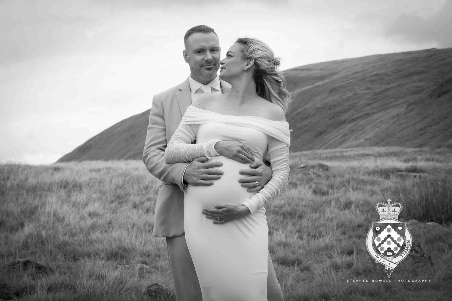 A collection of romantic black and white engagement photos showing couples embracing in scenic outdoor settings.
