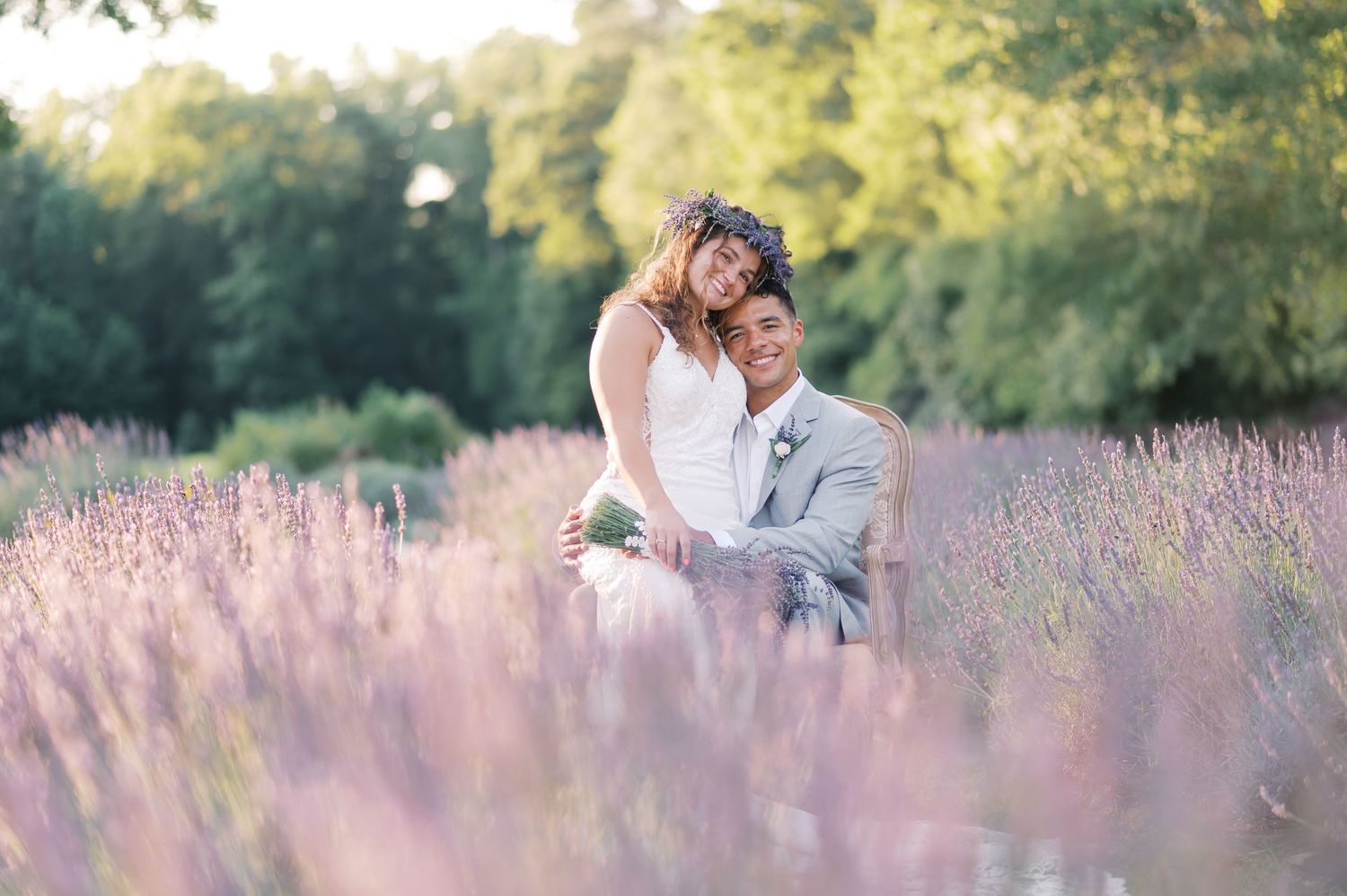 Romantic couple embraces in a dreamy lavender field at sunset near Fayetteville, Raleigh and Pinehurst NC