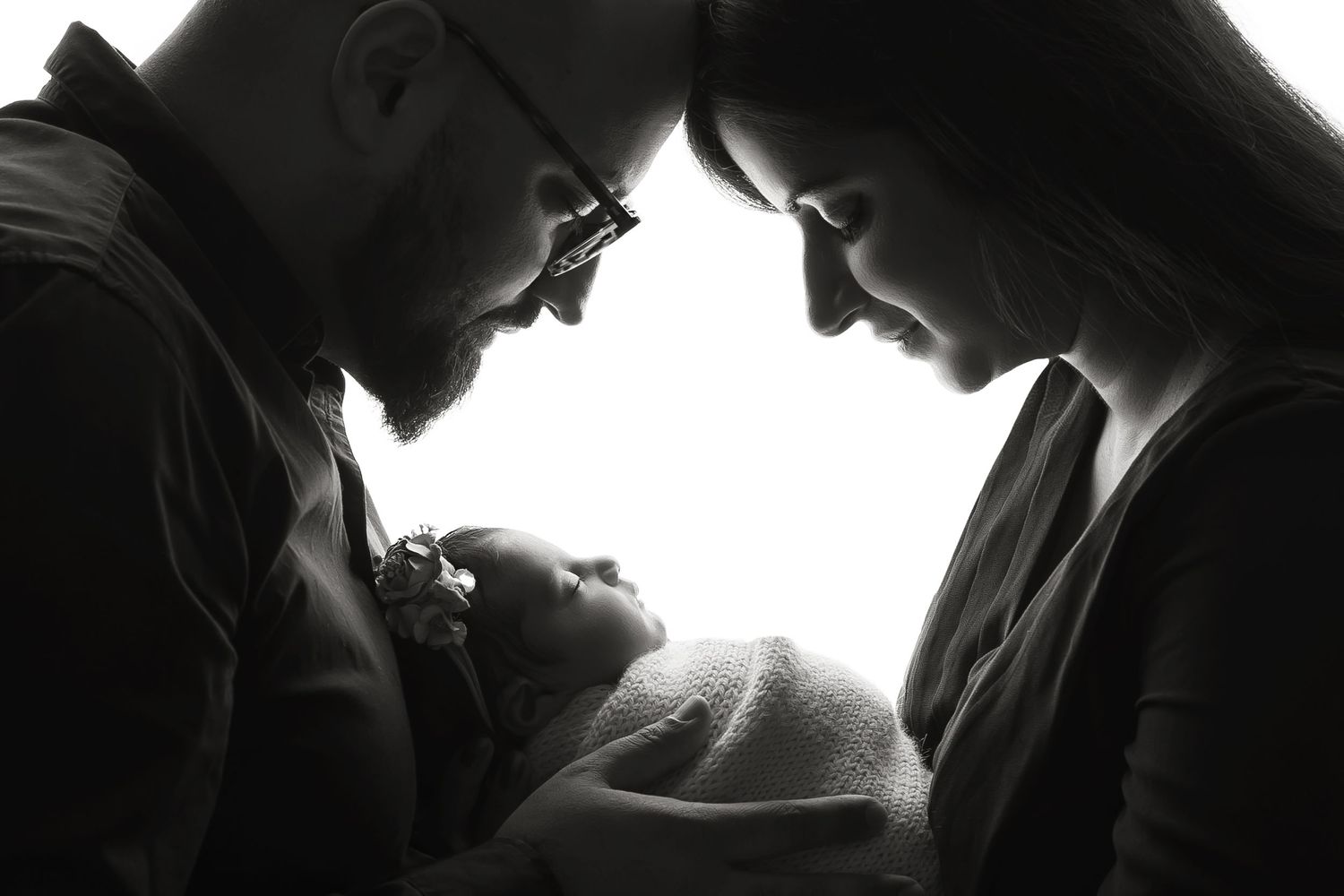 Black and White portrait photo of a parent holding their baby in Hayes.
