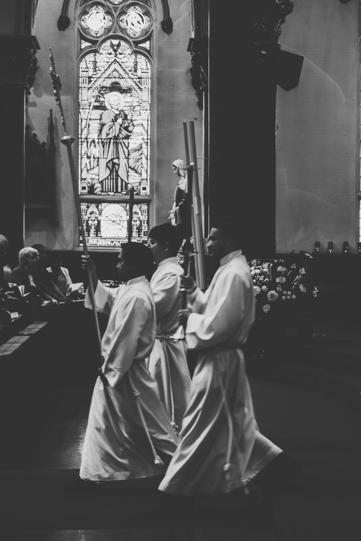 three alter servers begin the ascension at the end of mass at st andrew's cathedral in victoria, bc.