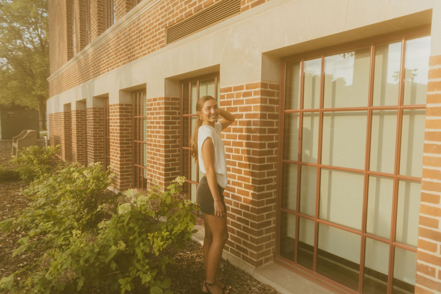 Exterior view of a modern brick building with large windows.