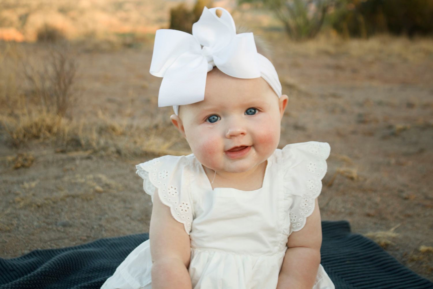 A baby girl during a family photo session at Palo Duro Canyon State Park in Canyon, Texas