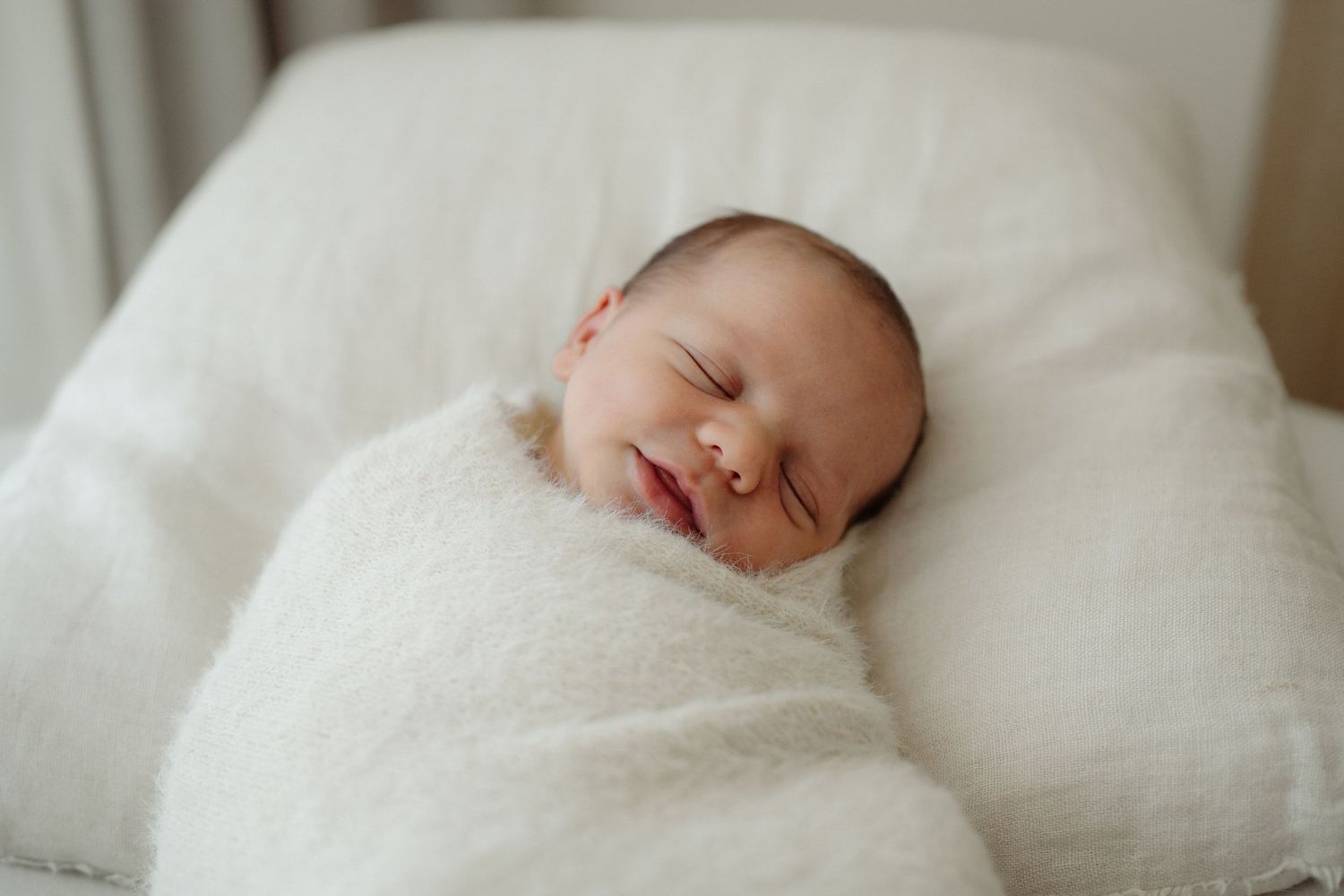 Newborn baby in home session on the beanbag in Auckland