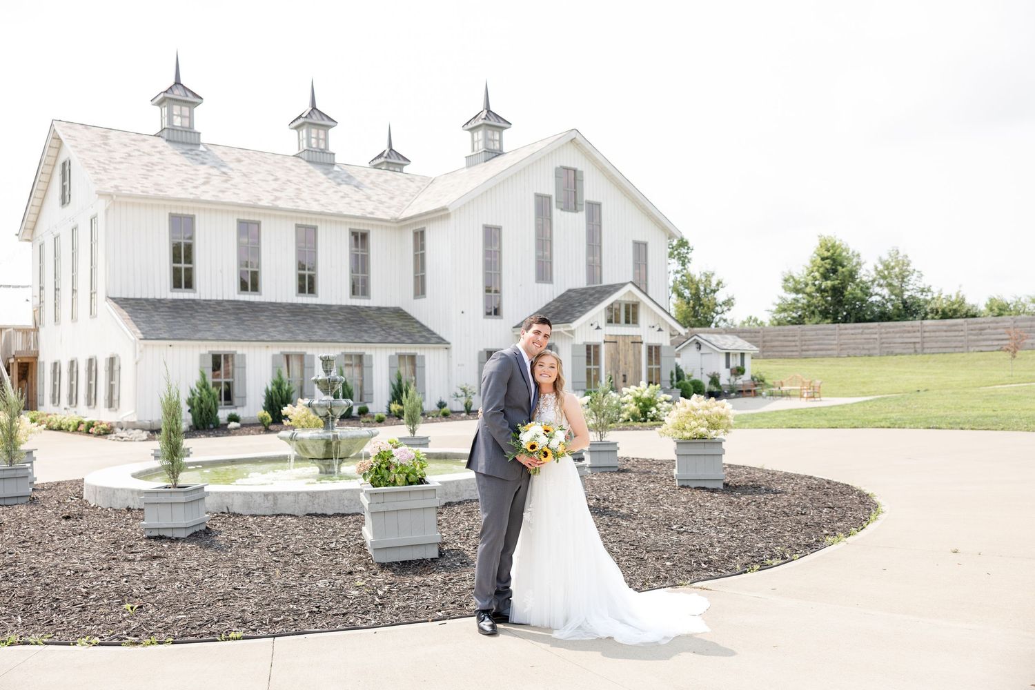 Joyful summer wedding at The Bicentennial Barn in Dayton, Ohio, photographed by Dayton wedding photographers Julia and Sean Photography.
