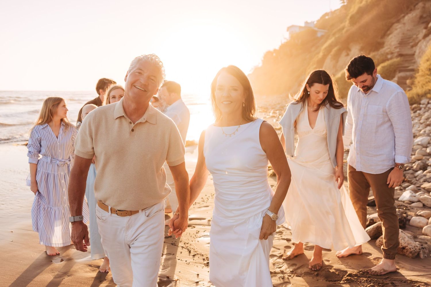 An extended family being photographed on Hendry's Beach by Santa Barbara family reunion vacation photographer