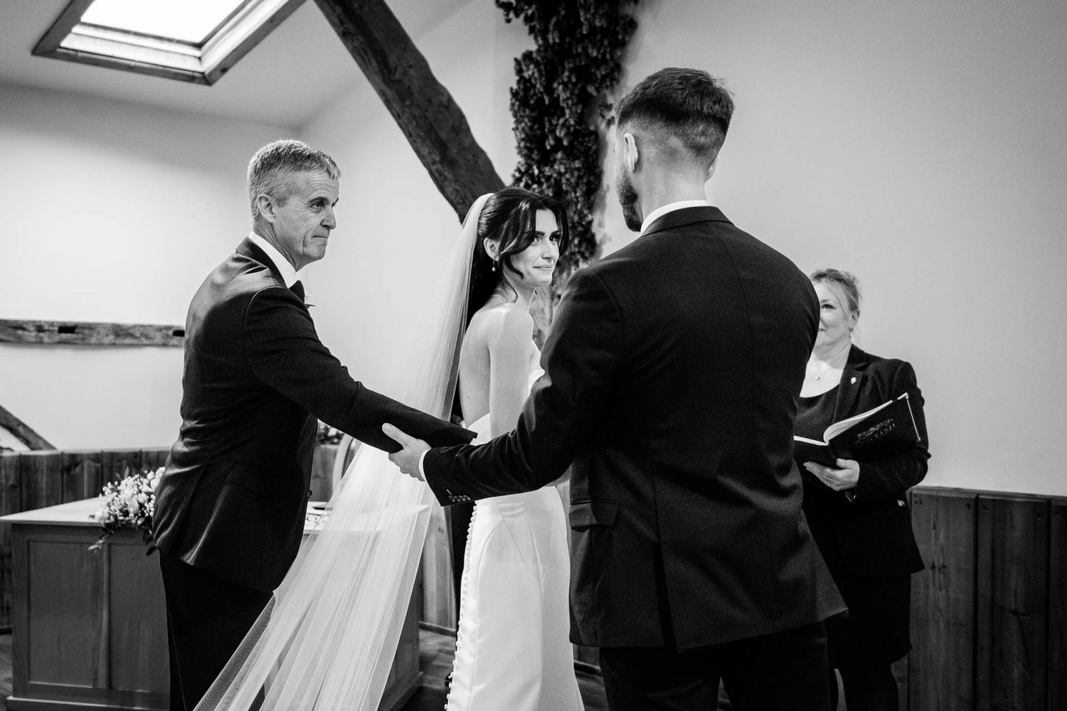 Wedding Photography Winters Barns in Kent. Father of bride shaking hands with groom.