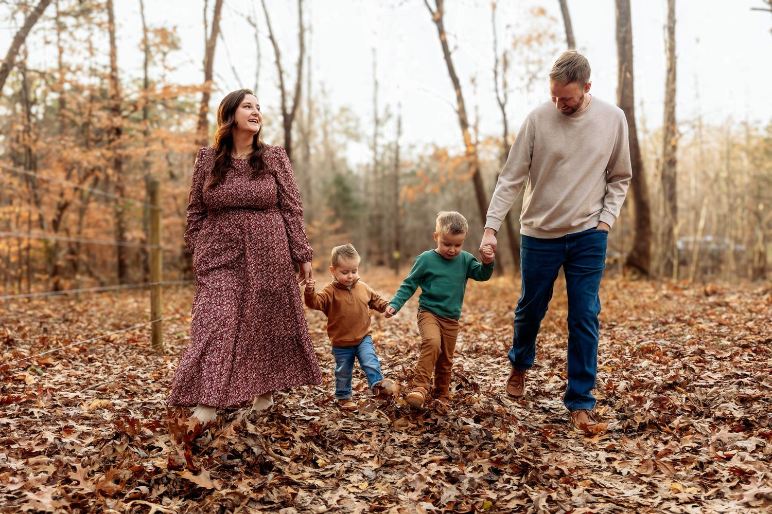 Family taking photos outdoors in coordinated non matchy outfits