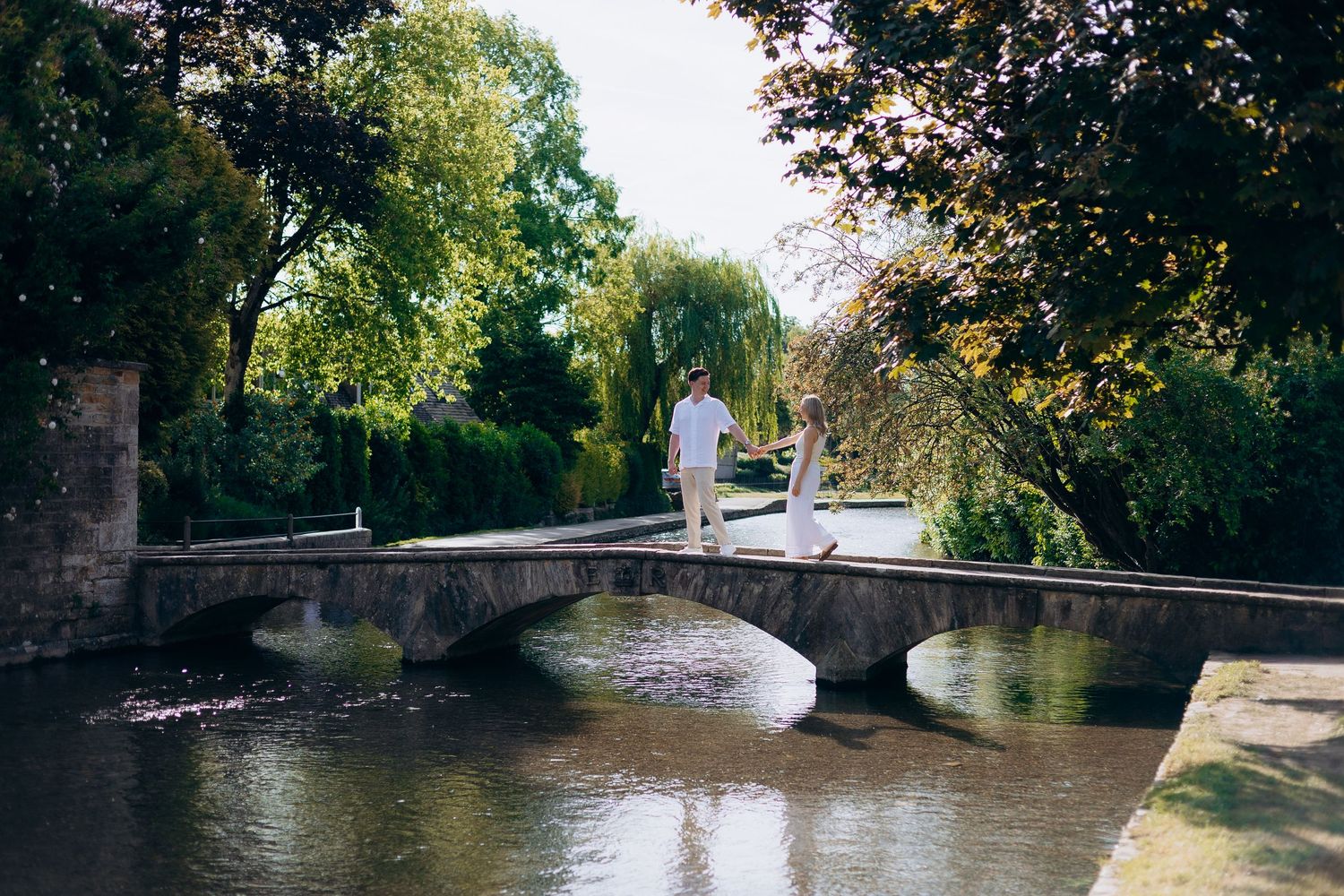 Bourton-on-the-Water proposal photographer capturing a surprise proposal in the Cotswolds.