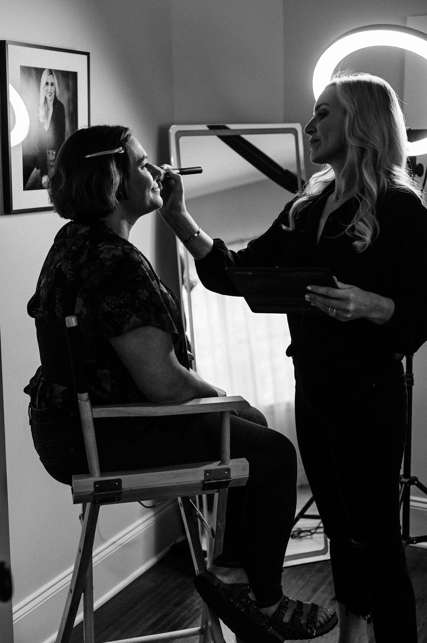 Professional makeup application process showing eyeshadow and cosmetic brushes in action.