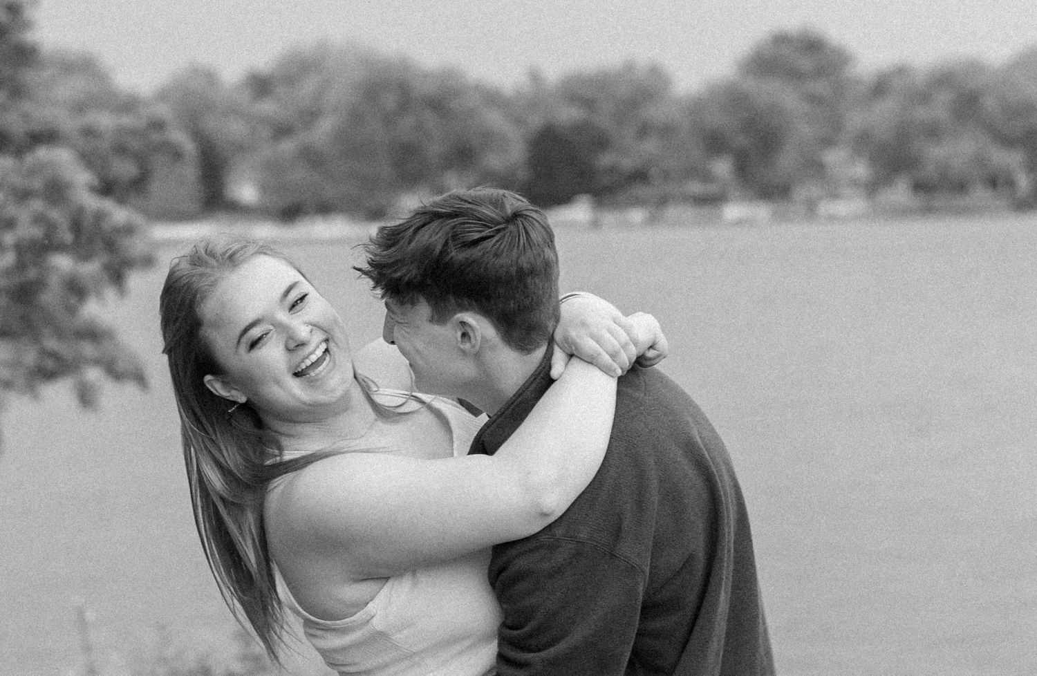 Outdoor summer engagement photos at the lake in Bloomington, Illinois