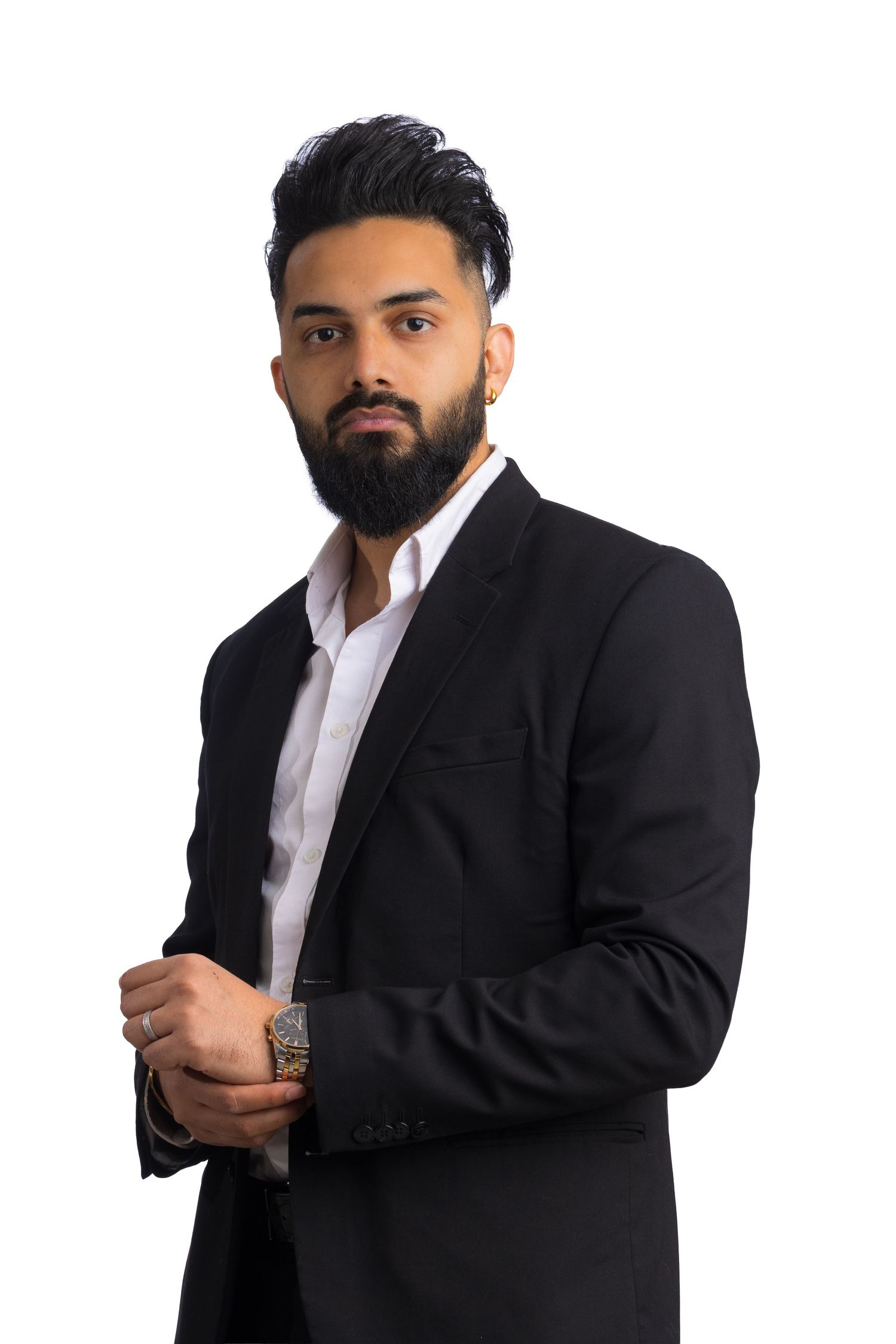 Smiling man with a beard and woman with long hair posing together in black business attire against a white background.
