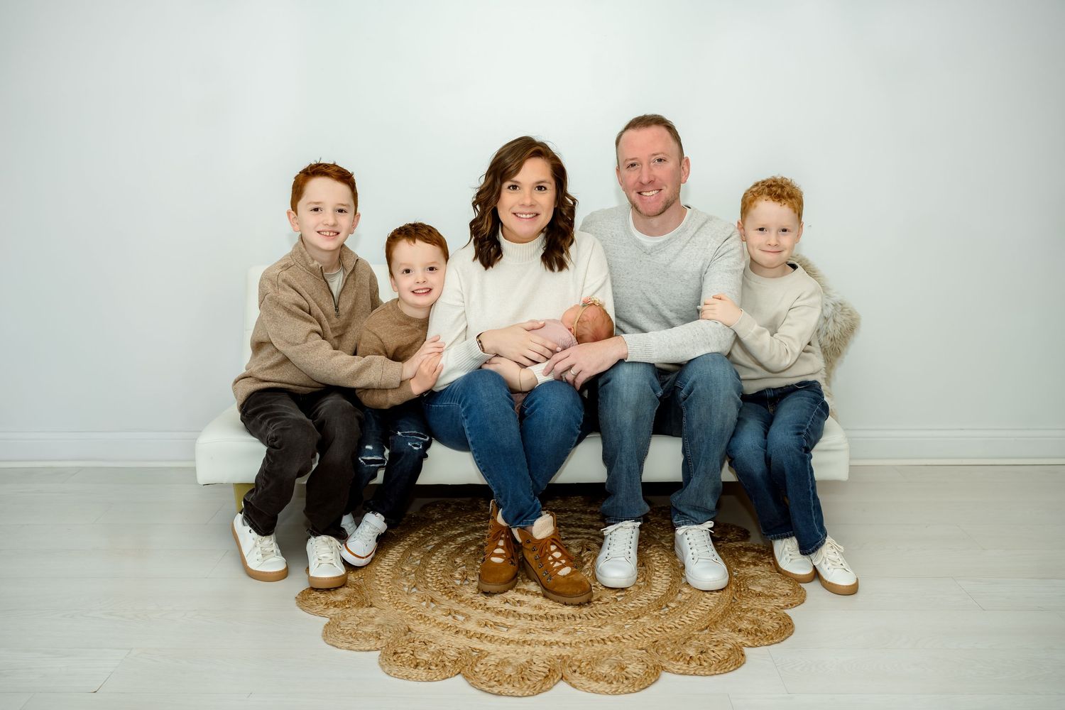 A series of holiday family photos showing matching Christmas pajamas in front of decorated trees and wreaths.