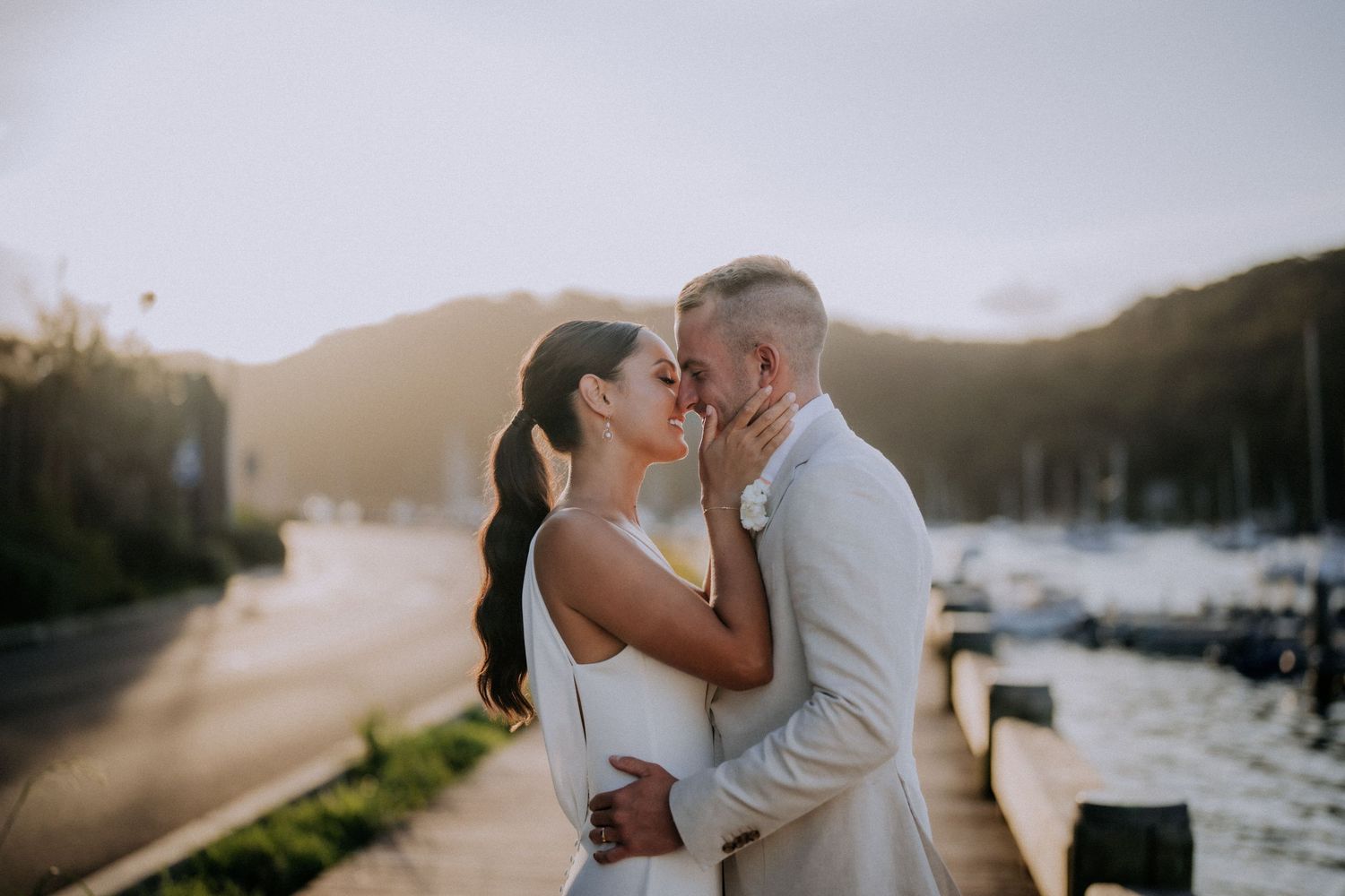 Romantic sunset portraits at a waterfront wedding location.