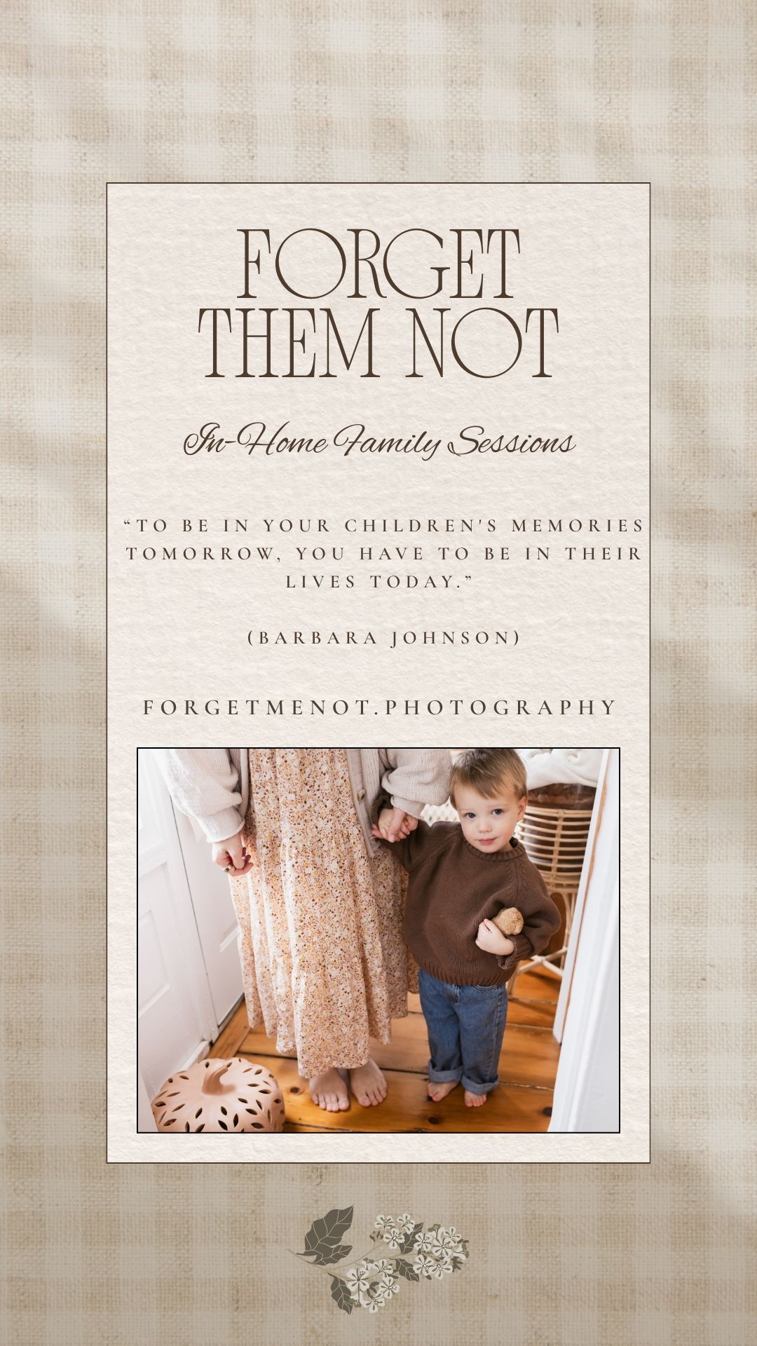 Toddler boy holds mother's hand wearing a floral dress and cream cardigan on wide plank farmhouse floors in Harvard, MA for family photos