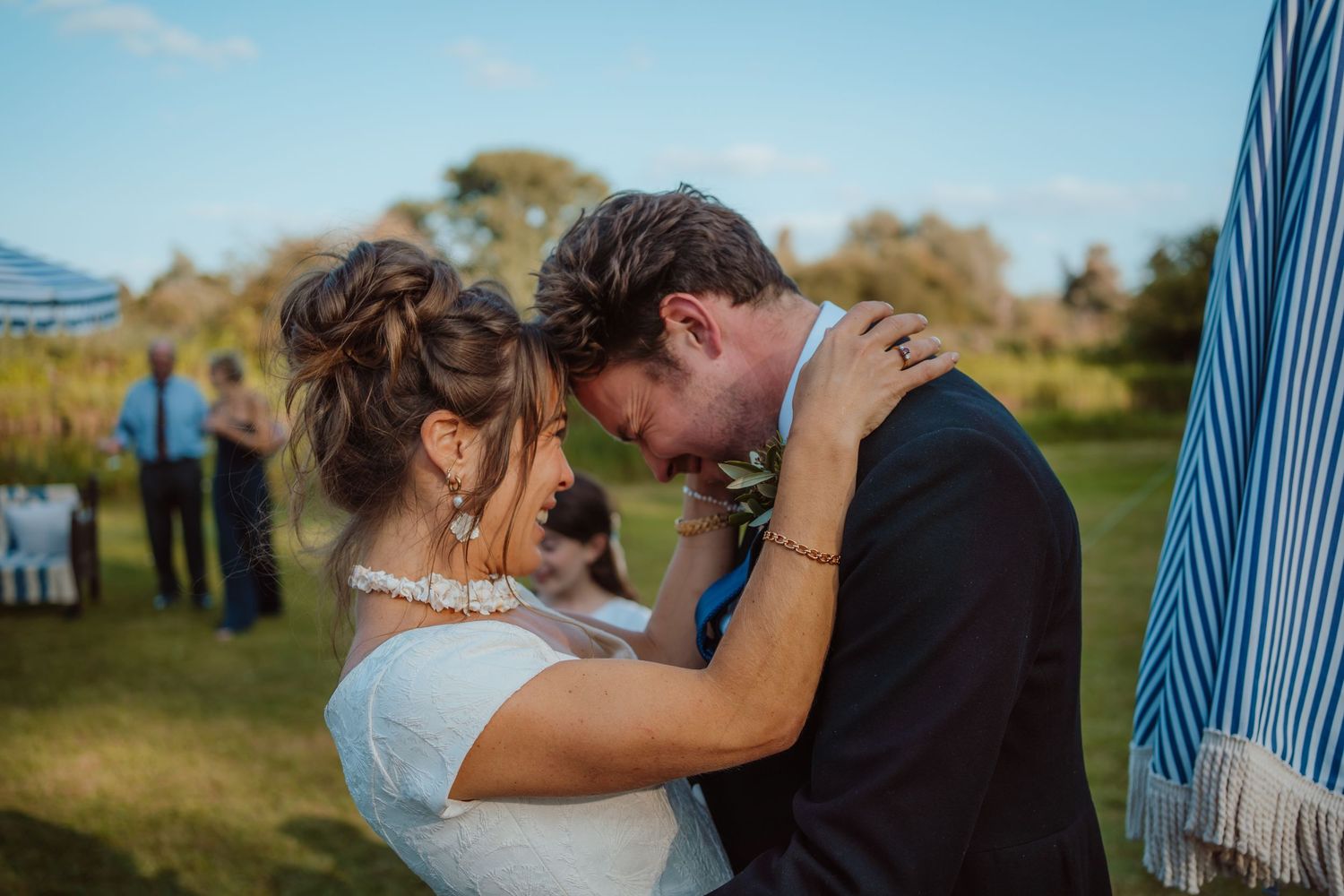 Romantic wedding celebration captured in a series of candid moments in an elegant indoor venue with natural lighting.
