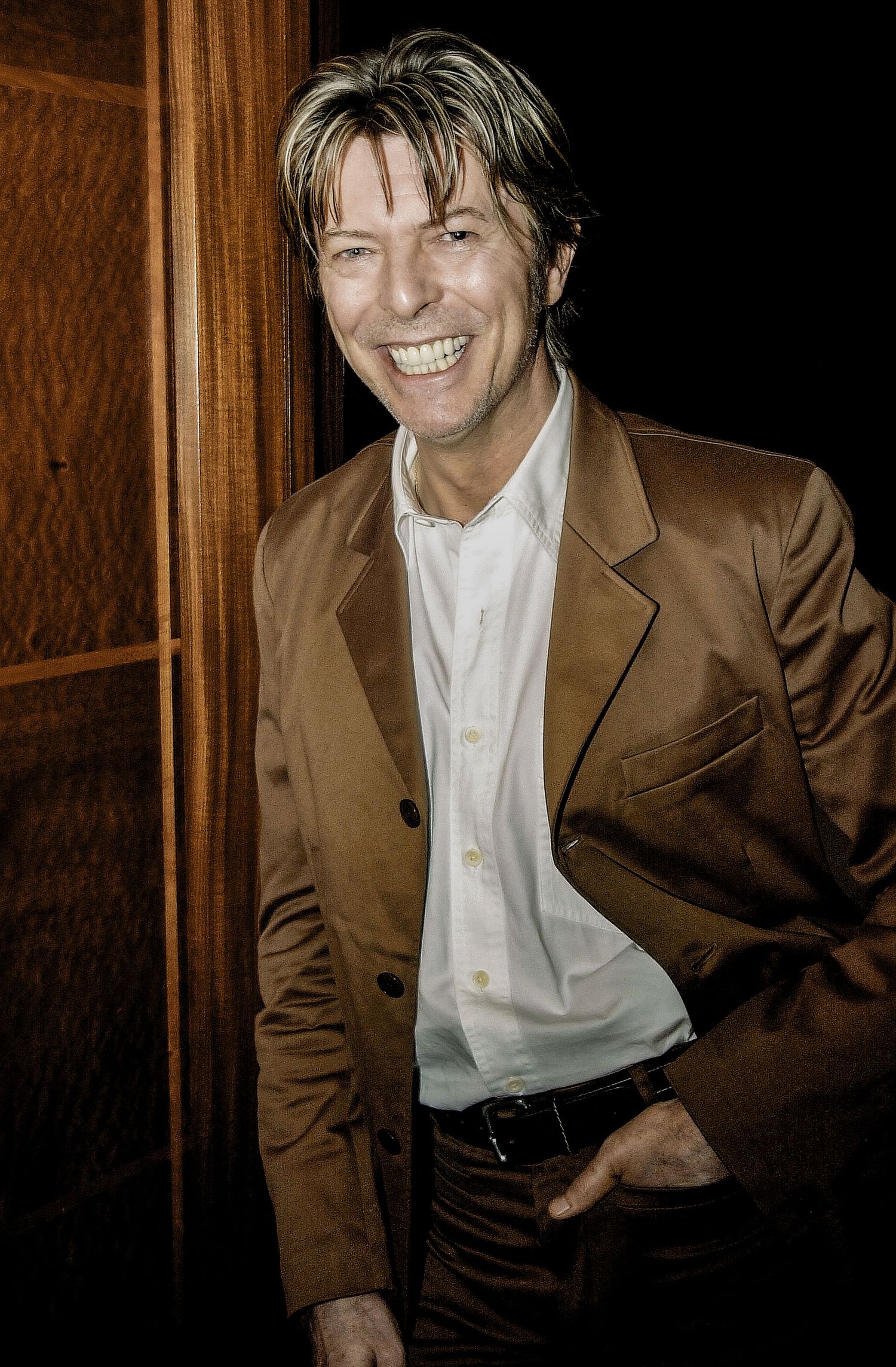 Editorial portrait of David Bowie photographed in London.