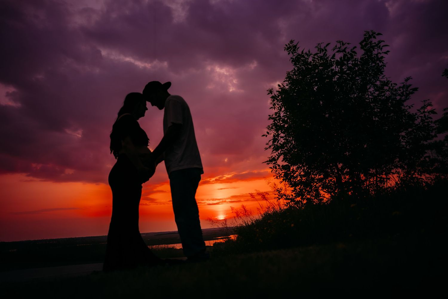 Silhouetted figures stand together against a dramatic purple and orange sunset sky in multiple romantic scenes.