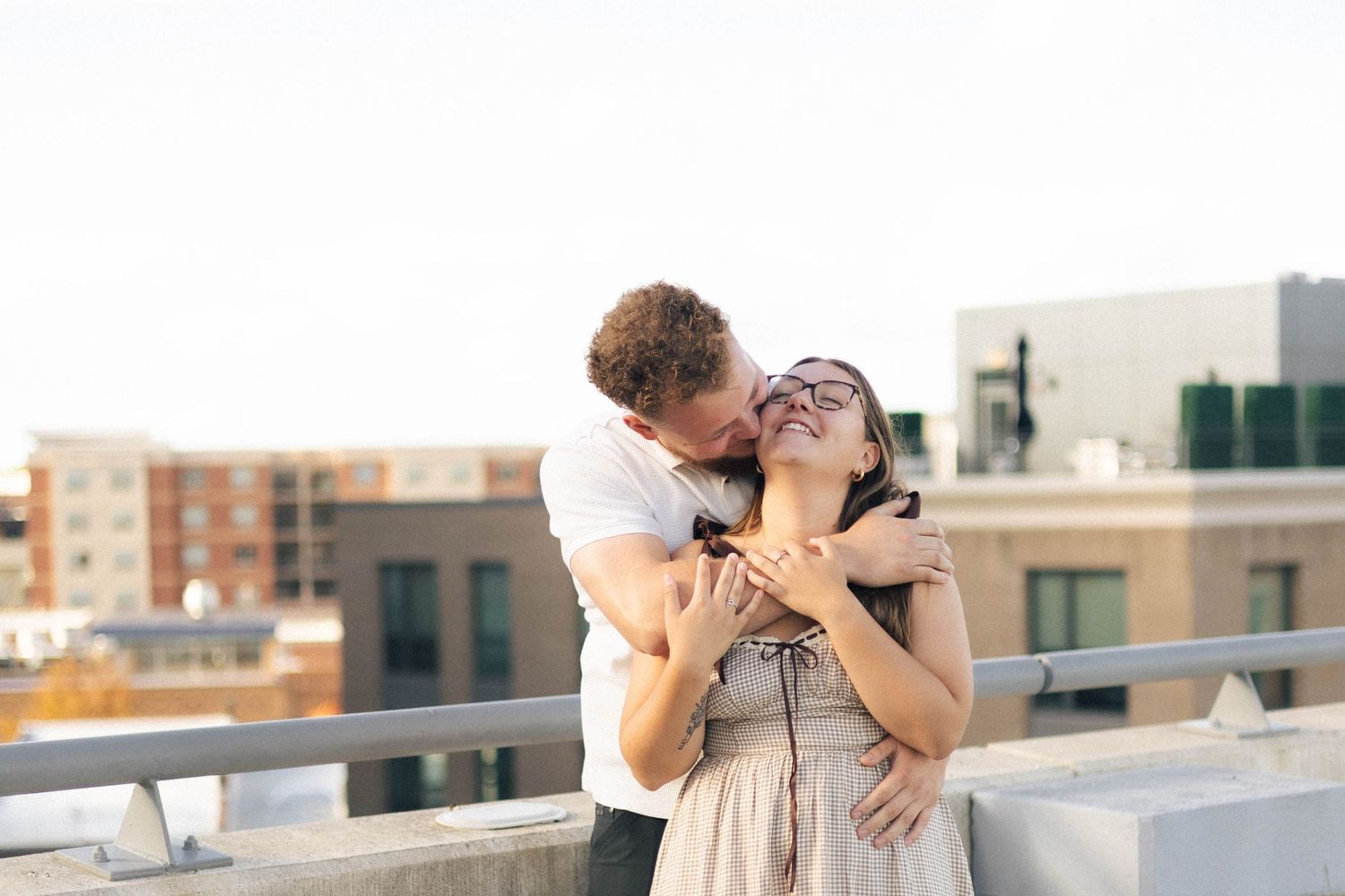 Outdoor uptown Normal summer engagement photos in Normal, Illinois