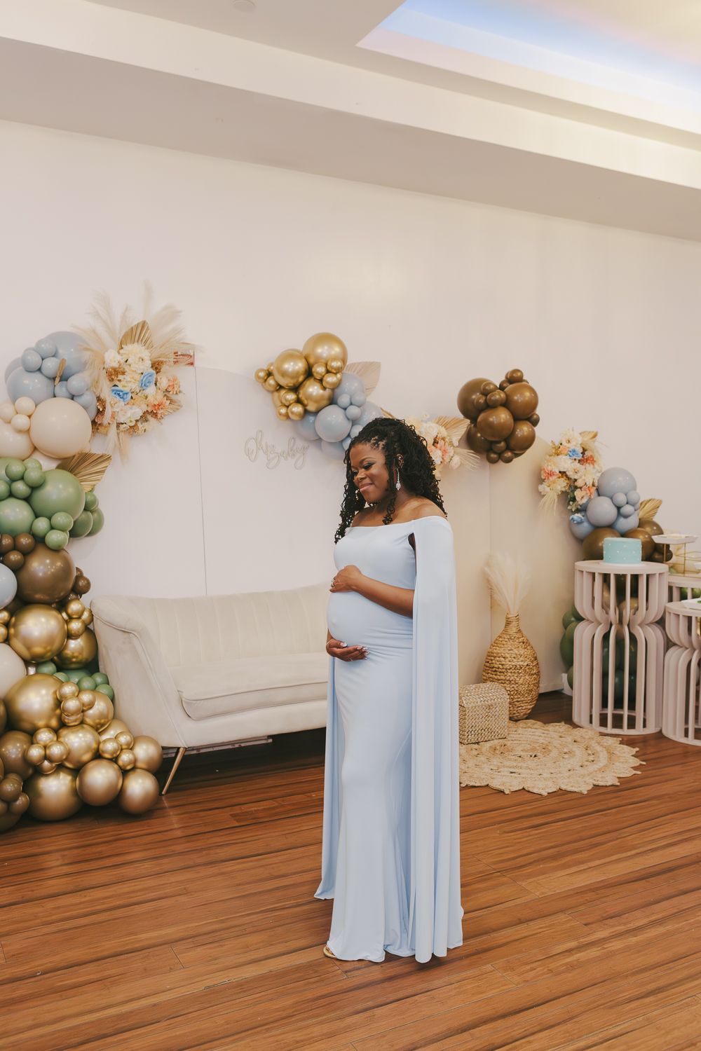 NYC baby shower photography of mom-to-be in pastel blue dress