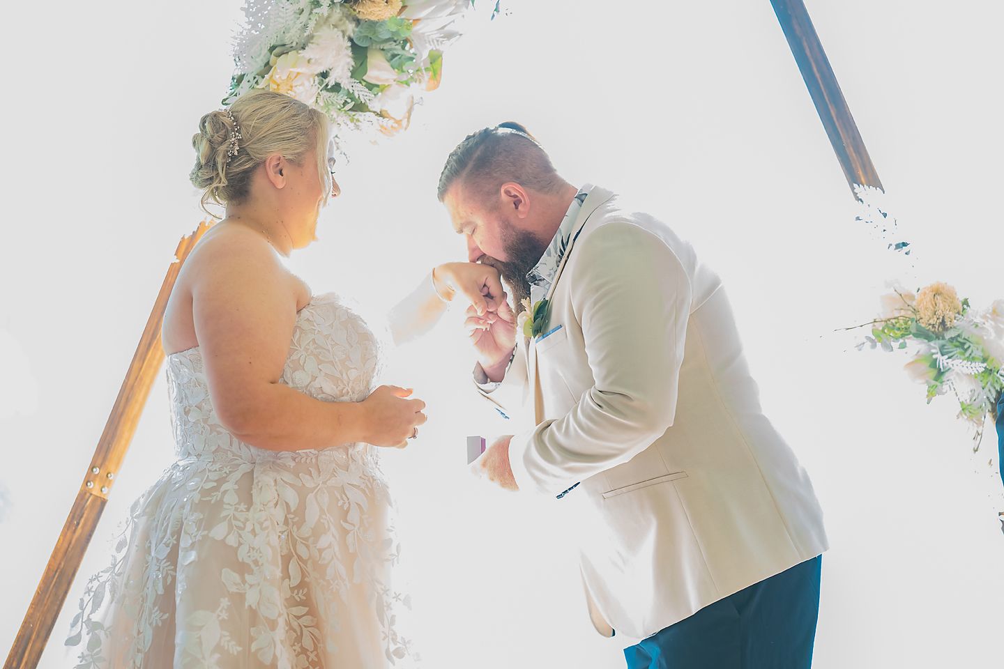 A wedding photo collage shows intimate moments between a bride and groom in light interior settings.