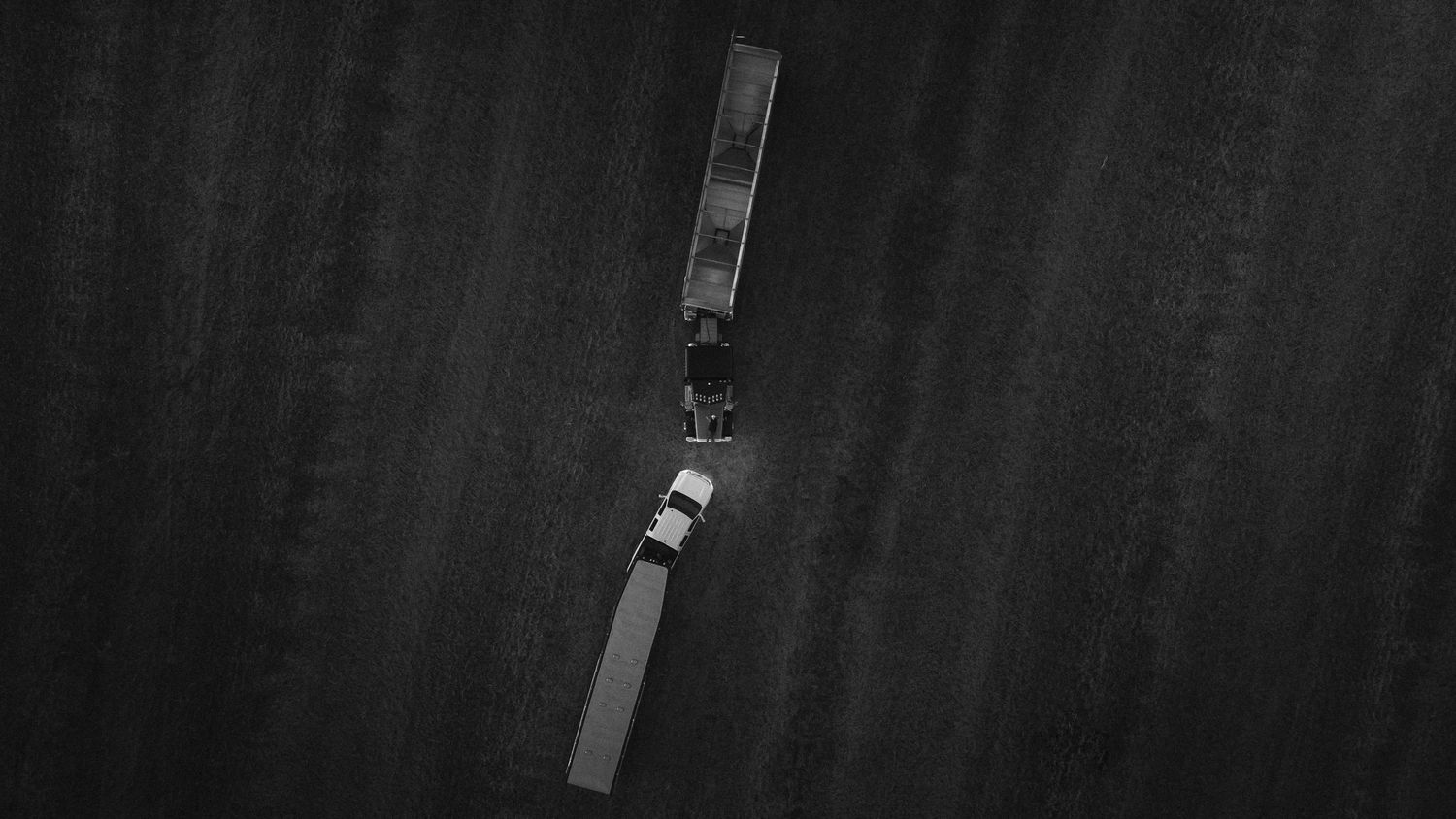 An aerial black and white view of a drone or aircraft in flight.