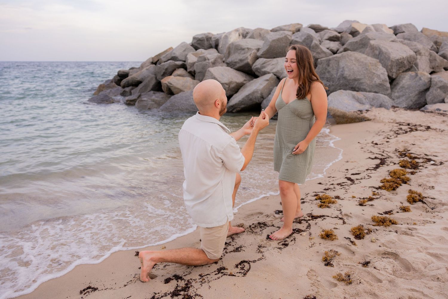 Surprise beach proposal in Fort Lauderdale at sunset, Romantic proposal on Fort Lauderdale beach with ocean view by Wanderlust Studios