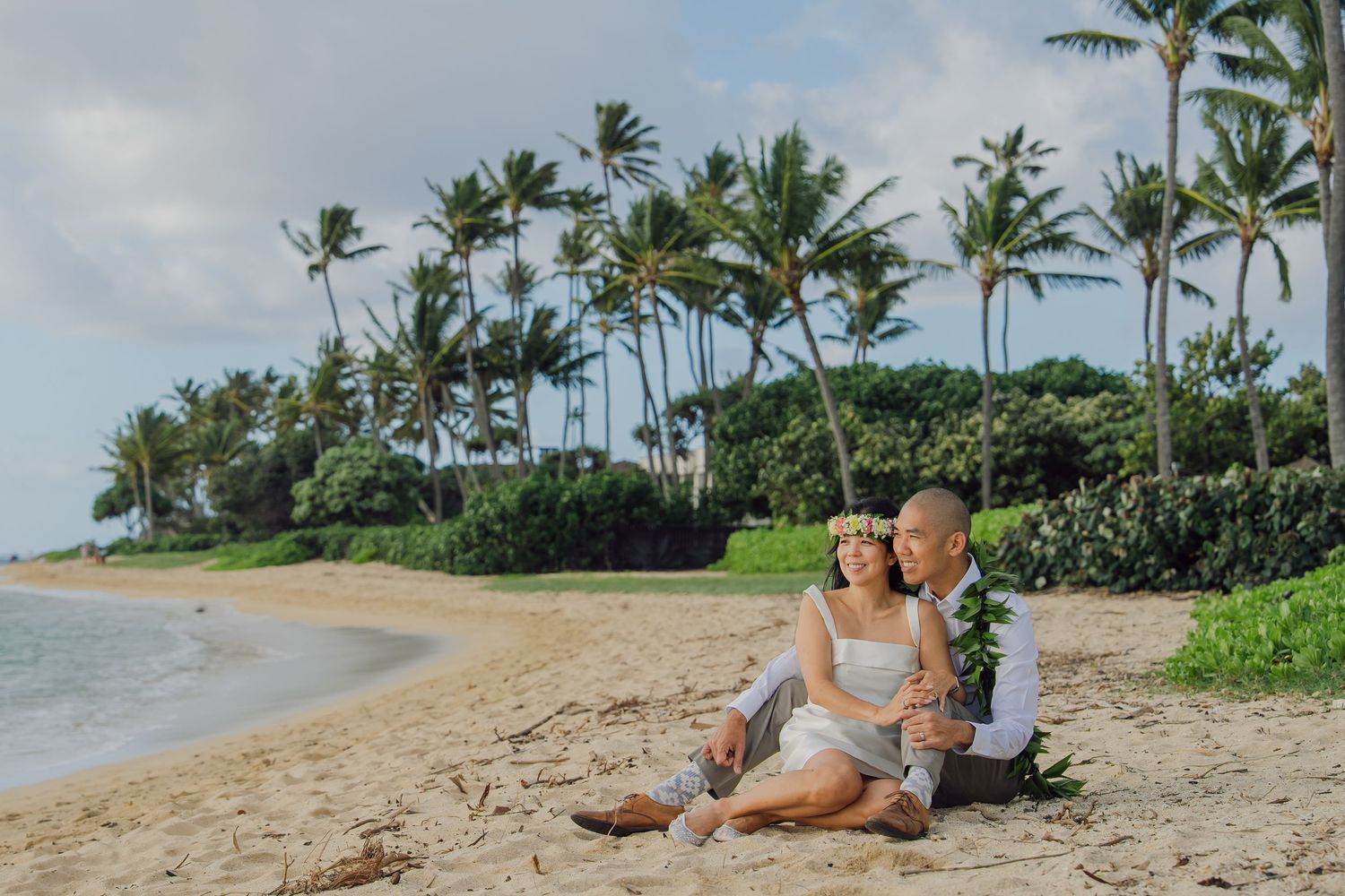 Scenic collage of a tropical beach with palm trees, sandy shores, and people relaxing along the coastline.